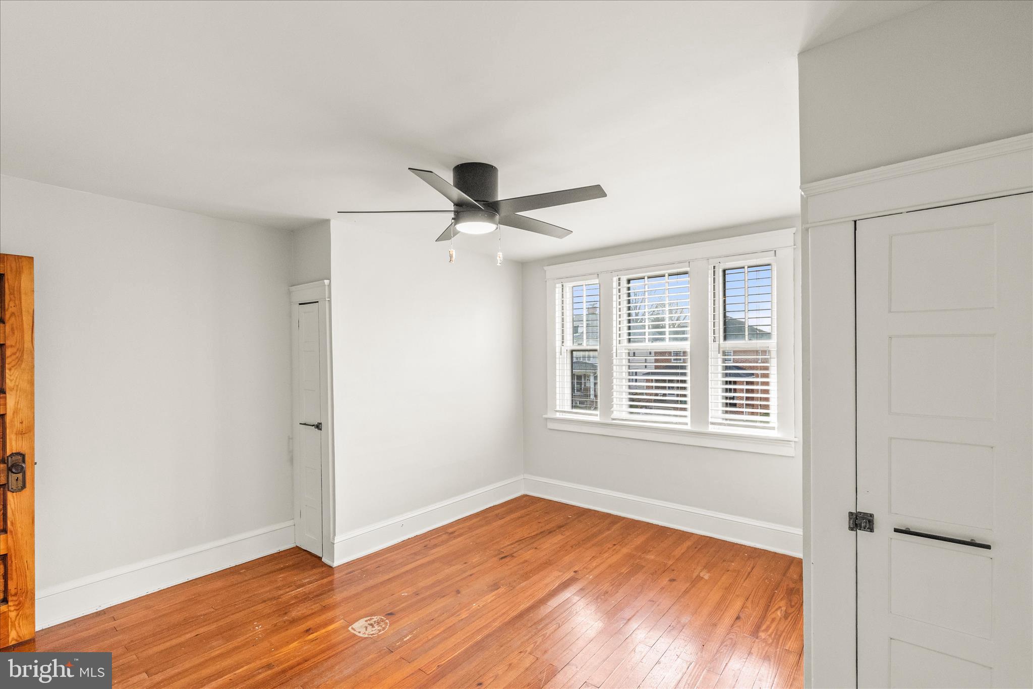 500 South Franklin Street Hanover, PA 17331 - Photo 19 of 36 a view of an empty room with a window and wooden floor