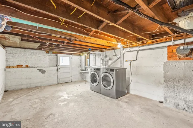 a view of empty room with wooden walls