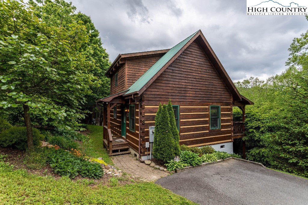 200 Apple Ridge Lane Blowing Rock, NC 28605 - Photo 1 of 17 a view of a house with a yard