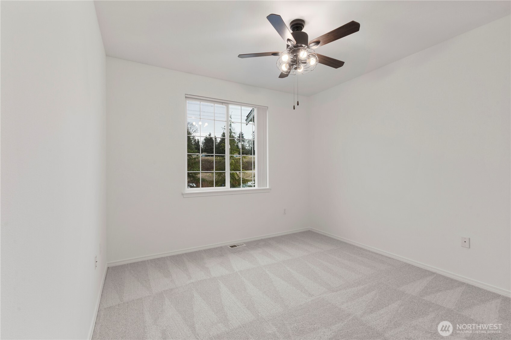 3220 Southeast 12th Street, Unit 1039 Renton, WA 98058 - Photo 16 of 27 an empty room with windows and ceiling fan
