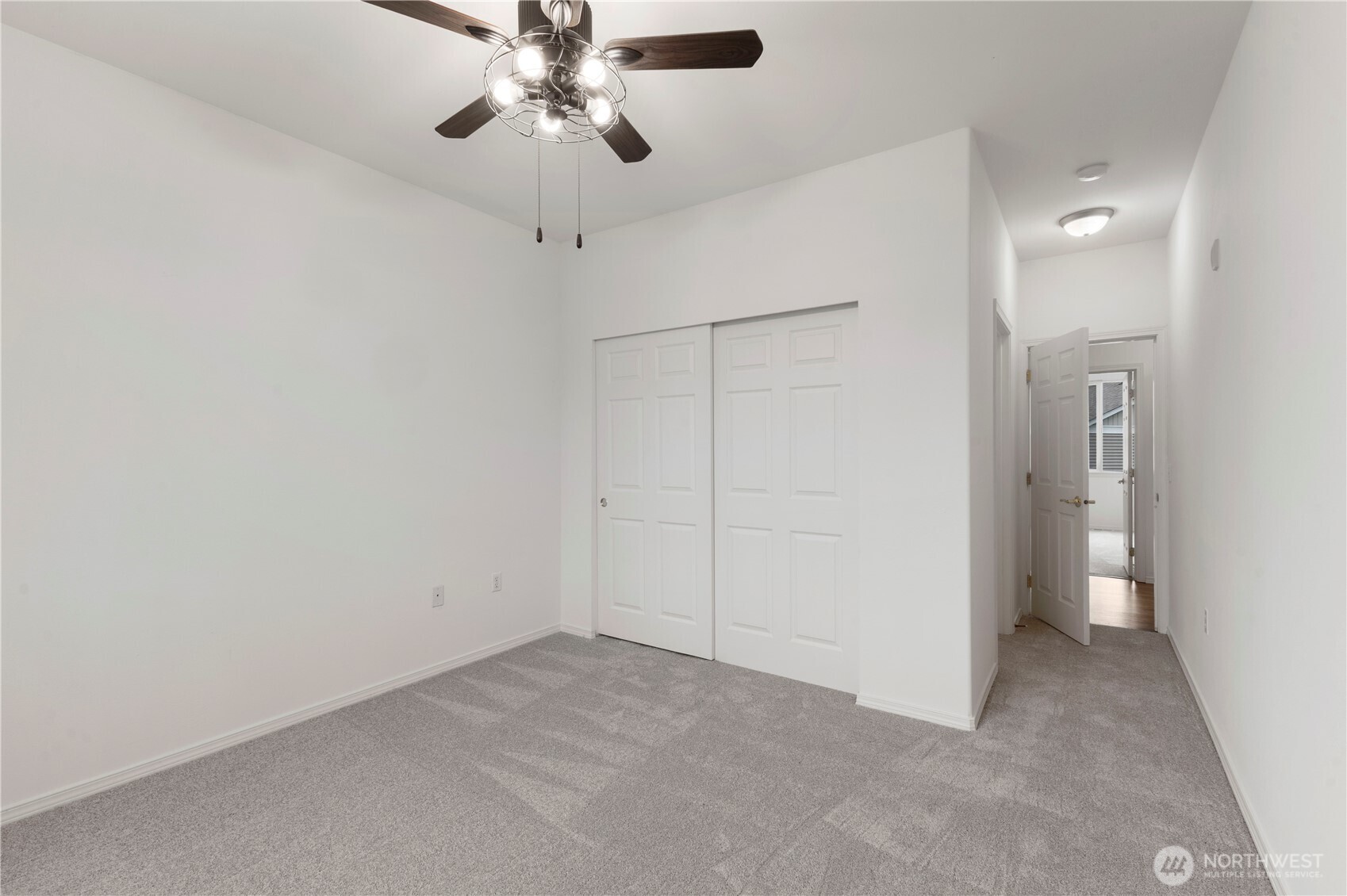 3220 Southeast 12th Street, Unit 1039 Renton, WA 98058 - Photo 17 of 27 a view of a livingroom and a chandelier fan