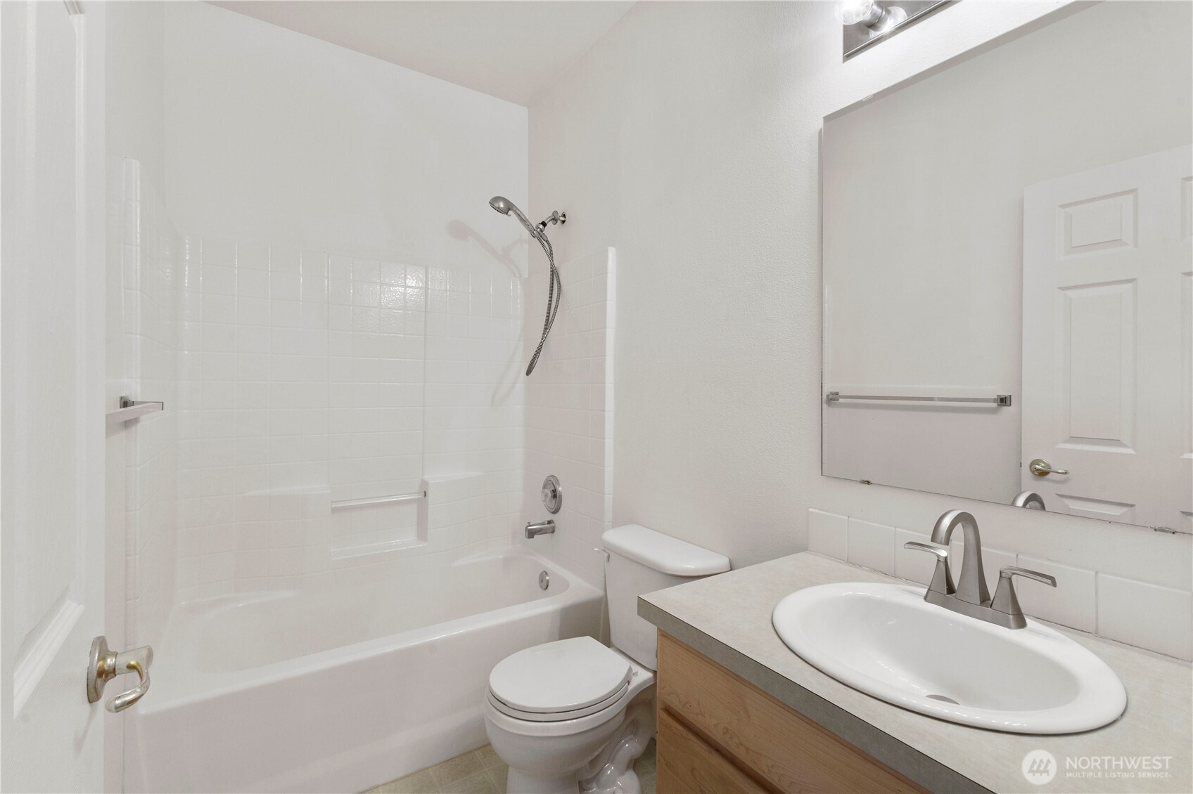3220 Southeast 12th Street, Unit 1039 Renton, WA 98058 - Photo 18 of 27 a bathroom with a sink toilet and shower