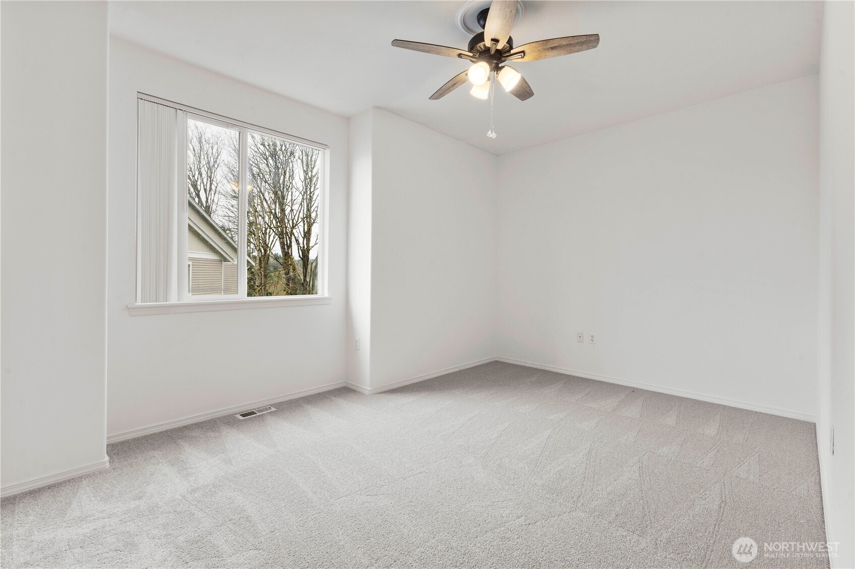 3220 Southeast 12th Street, Unit 1039 Renton, WA 98058 - Photo 20 of 27 an empty room with windows and fan
