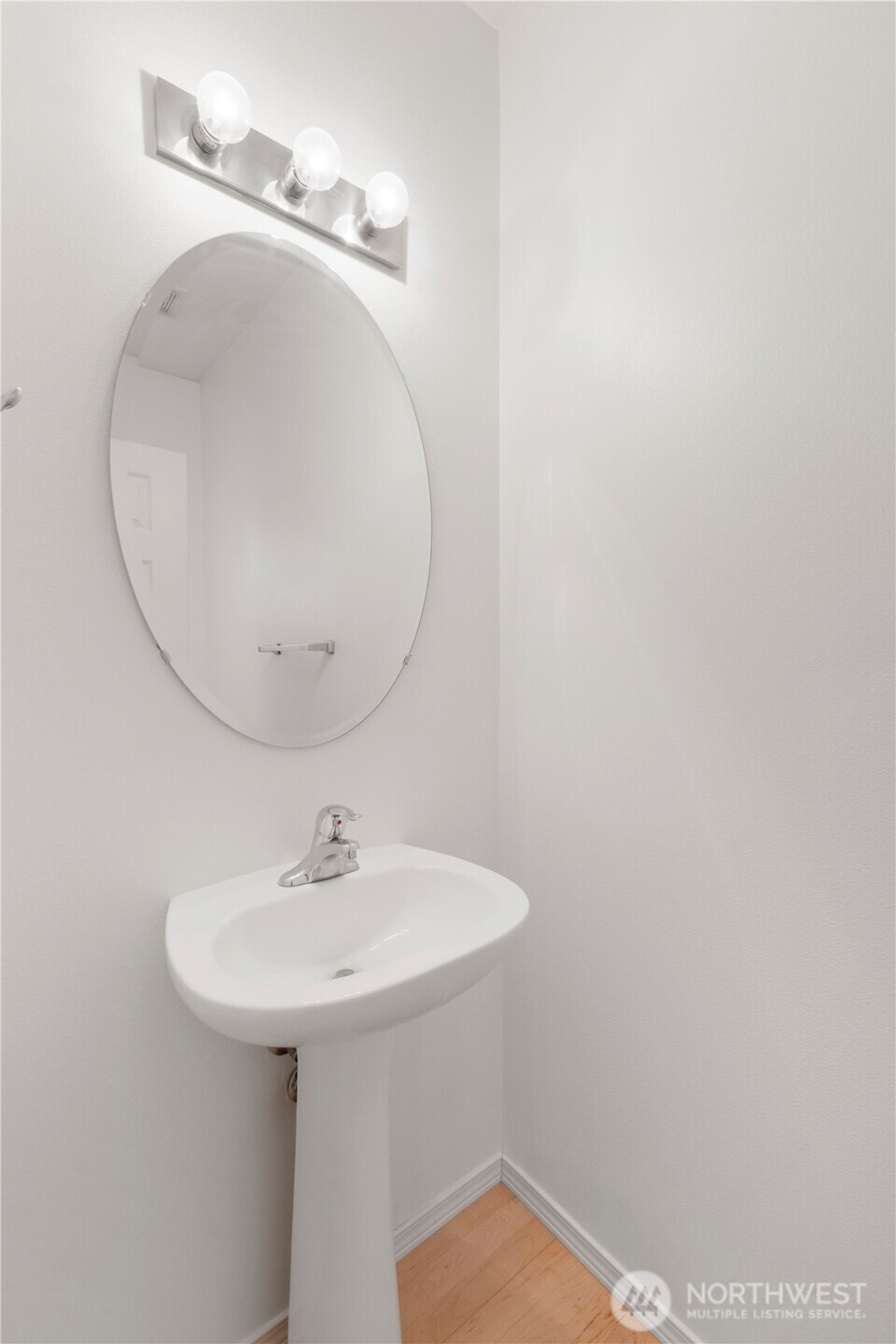 3220 Southeast 12th Street, Unit 1039 Renton, WA 98058 - Photo 4 of 27 a bathroom with a sink and a mirror