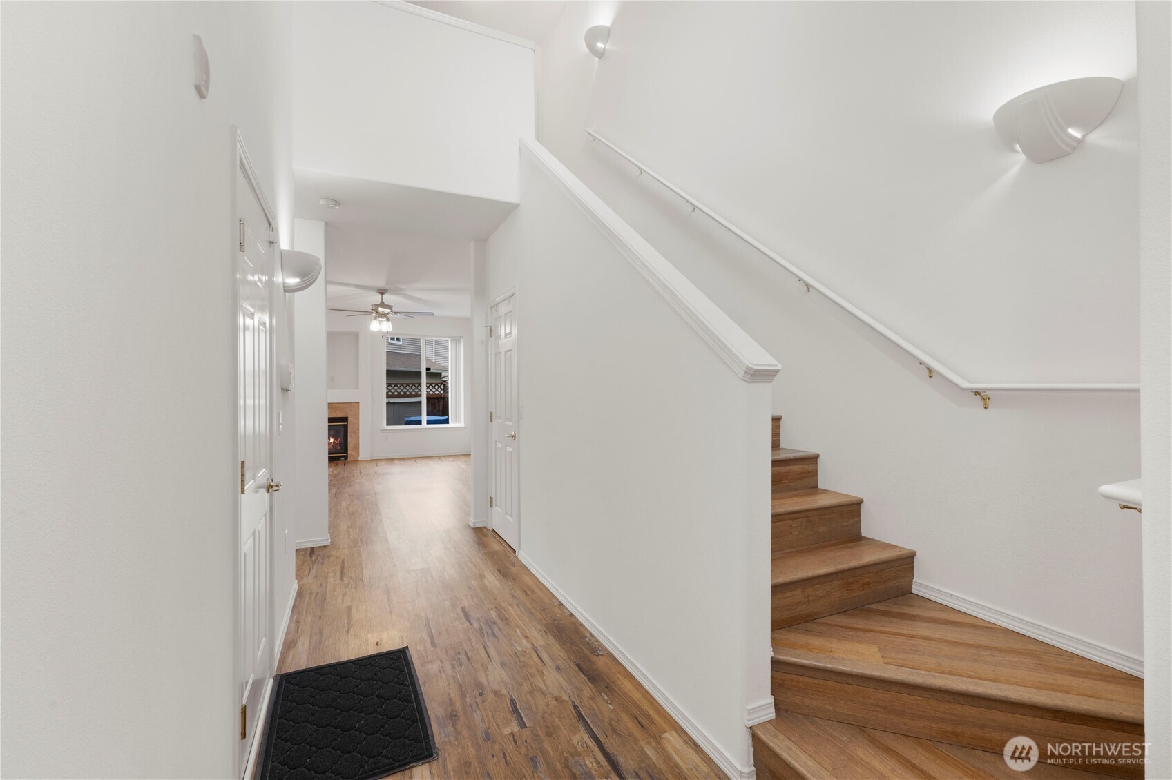 3220 Southeast 12th Street, Unit 1039 Renton, WA 98058 - Photo 5 of 27 a view of a hallway view with wooden floor and staircase