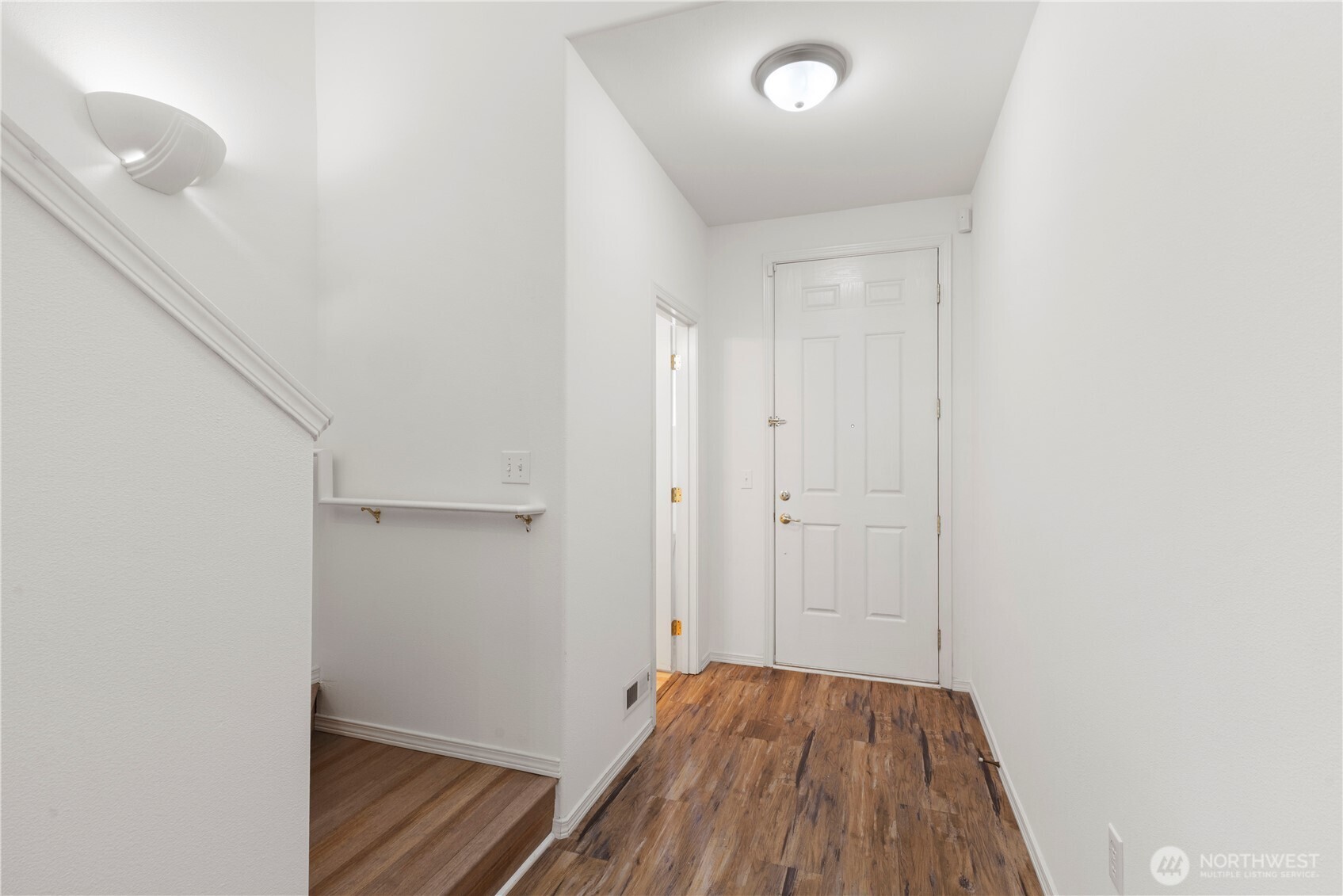 3220 Southeast 12th Street, Unit 1039 Renton, WA 98058 - Photo 6 of 27 a view of a hallway with wooden floor