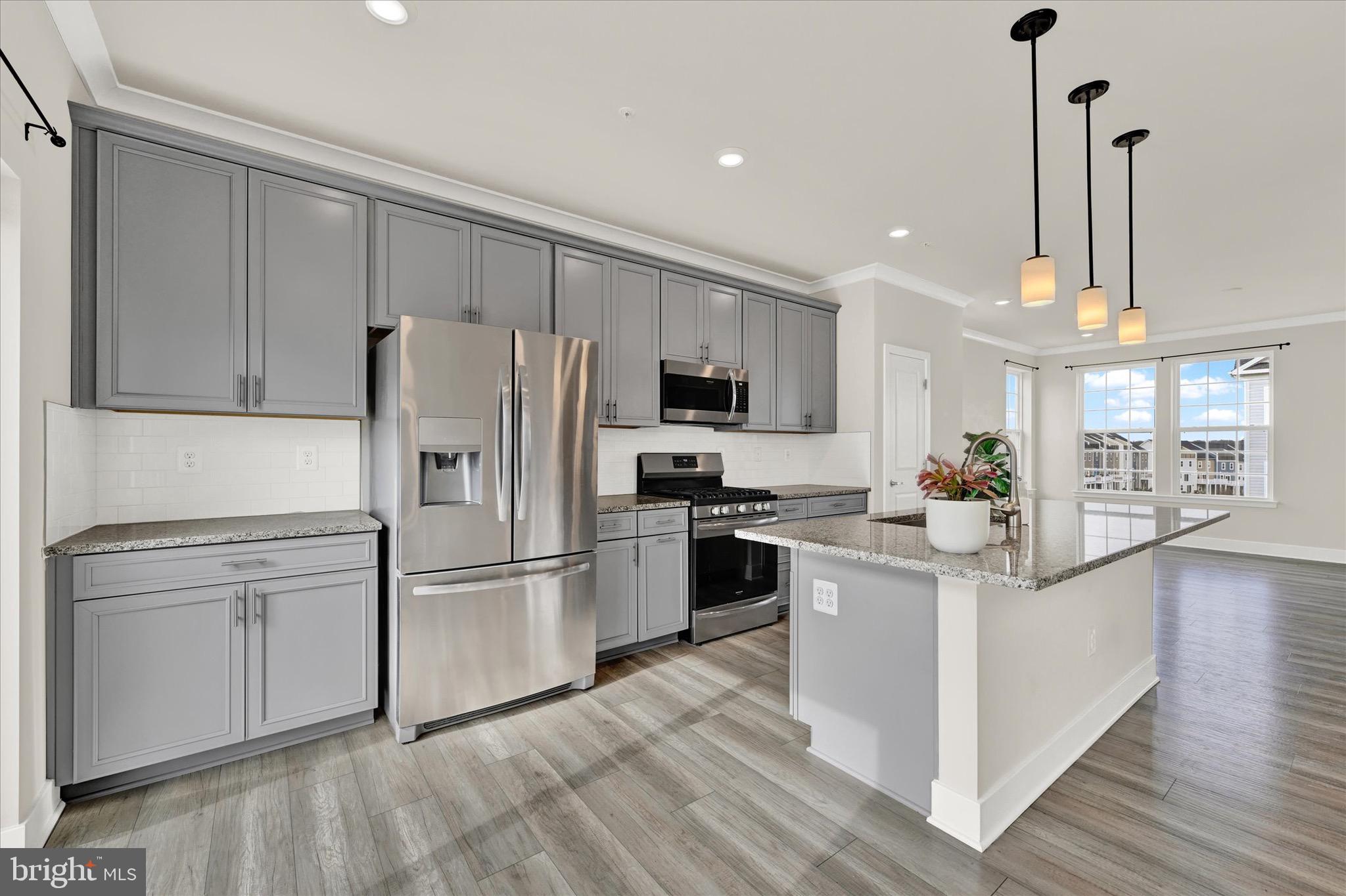 7797 Barrensdale Road Windsor Mill, MD 21244 - Photo 6 of 24 Luxury flooring and pendant lighting