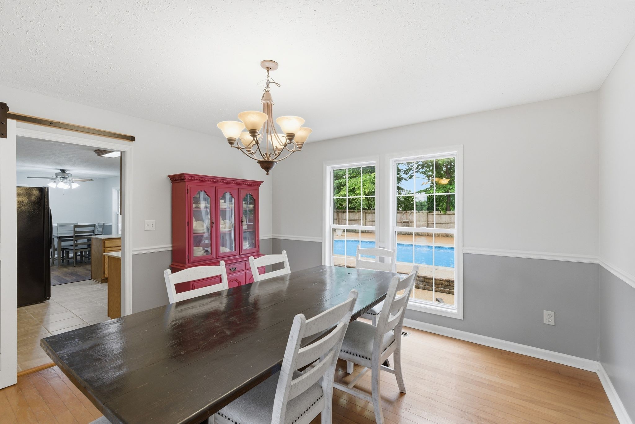 615 Vaughan's Gap Road Spring Hill, TN 37174 - Photo 5 of 26 a view of a dining room with furniture a chandelier and wooden floor