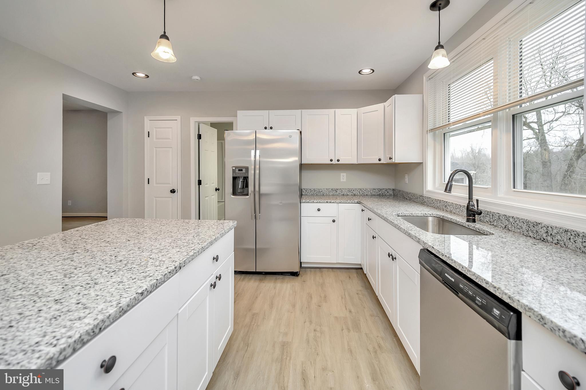 11359 Old Stillhouse Road Boston, VA 22713 - Photo 5 of 43 Pendant lighting and white cabinets