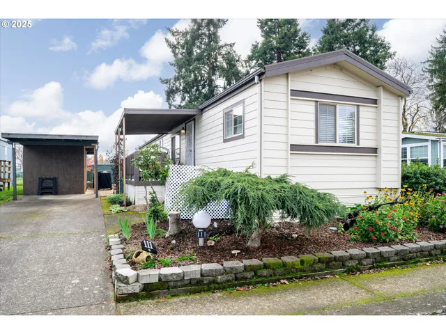 a view of a house with backyard porch and sitting area