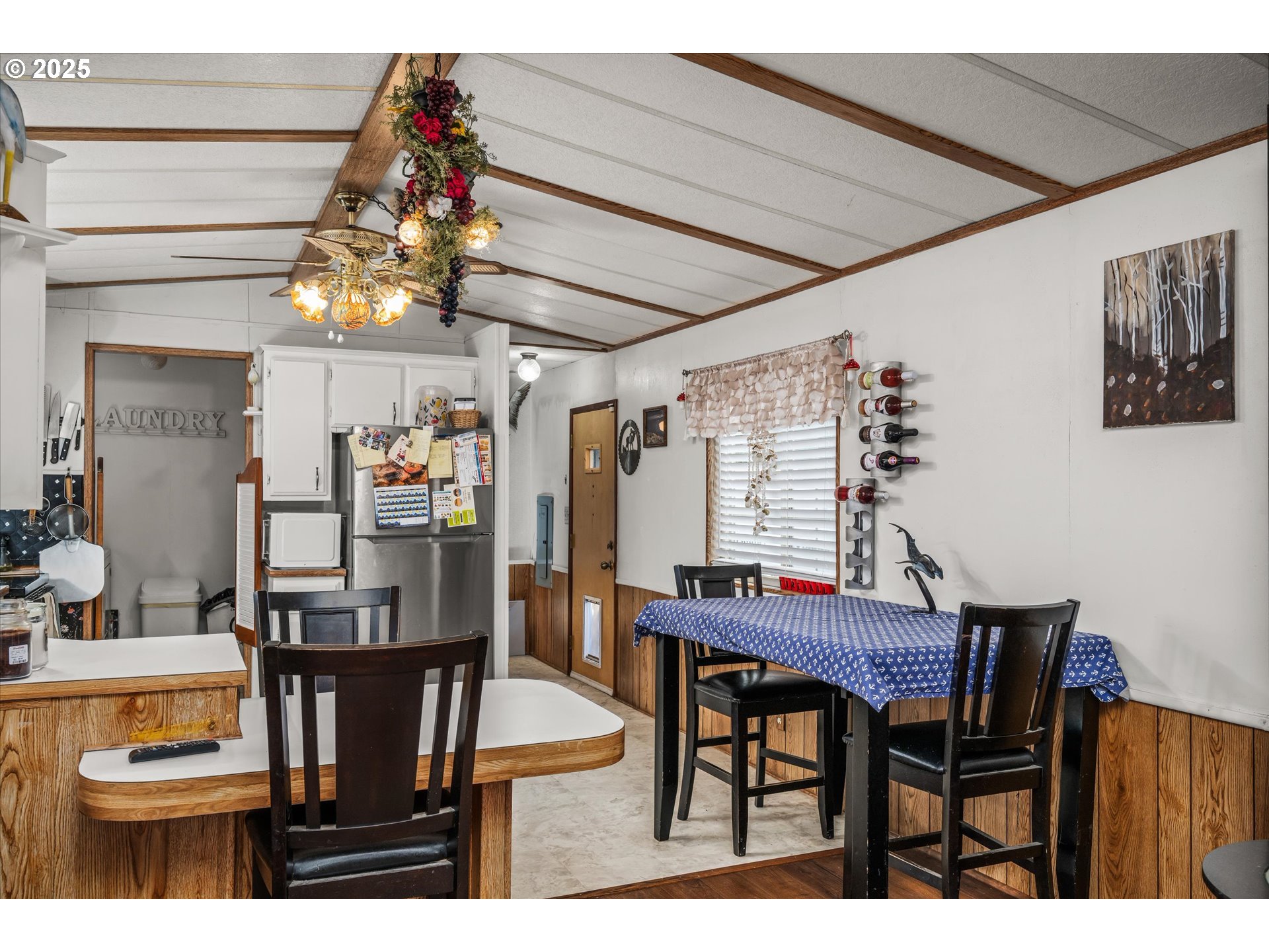 2150 Laura Street, Unit 111 Springfield, OR 97477 - Photo 11 of 30 a view of a dining room with furniture and chandelier