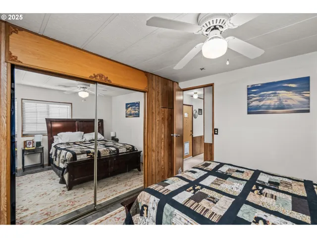a bedroom with furniture and a chandelier