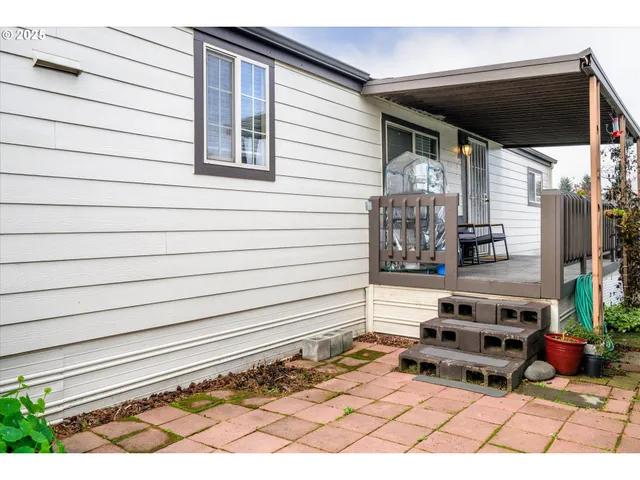 a backyard of a house with outdoor seating