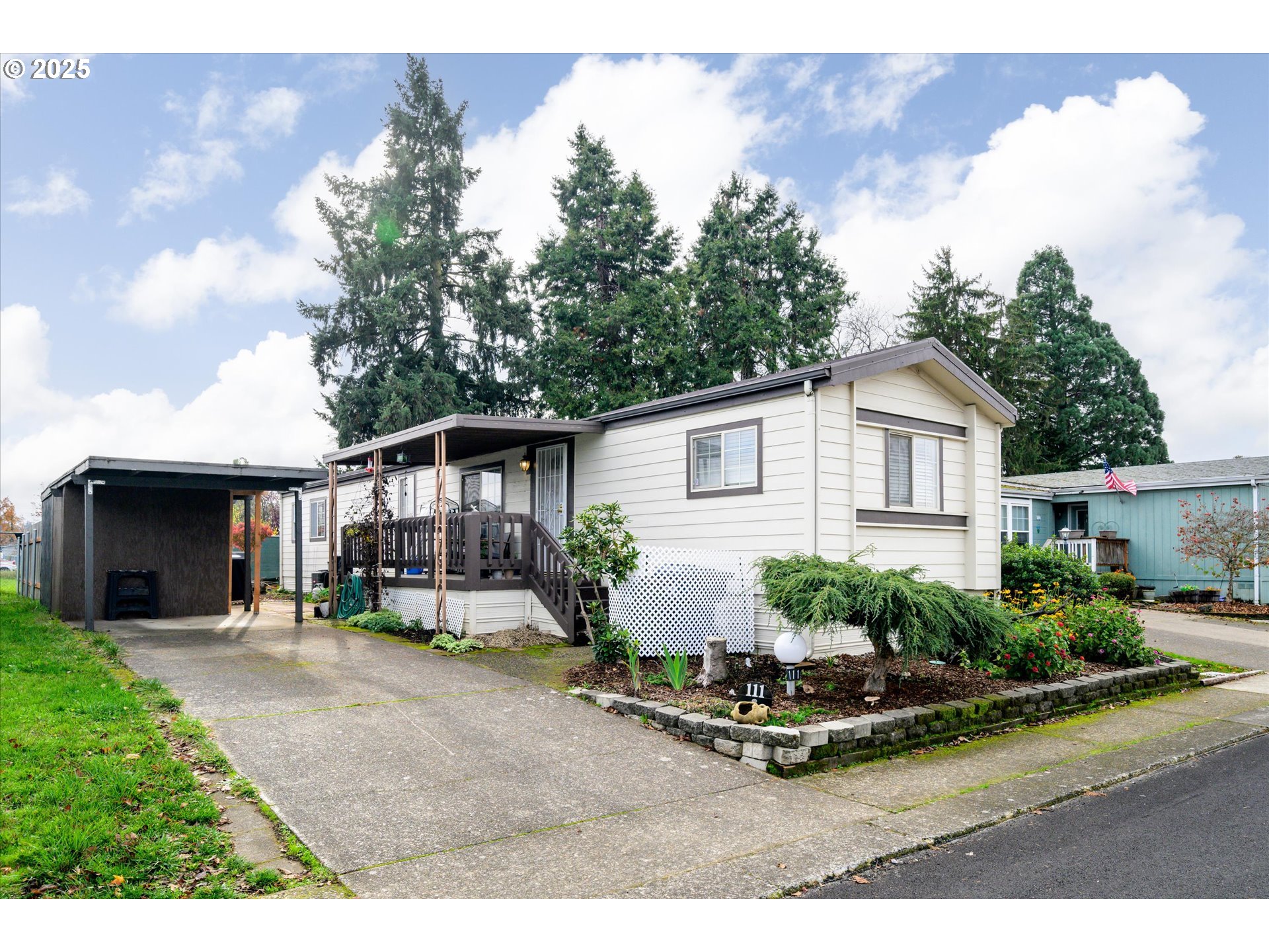 2150 Laura Street, Unit 111 Springfield, OR 97477 - Photo 3 of 30 a view of a house with backyard and sitting area