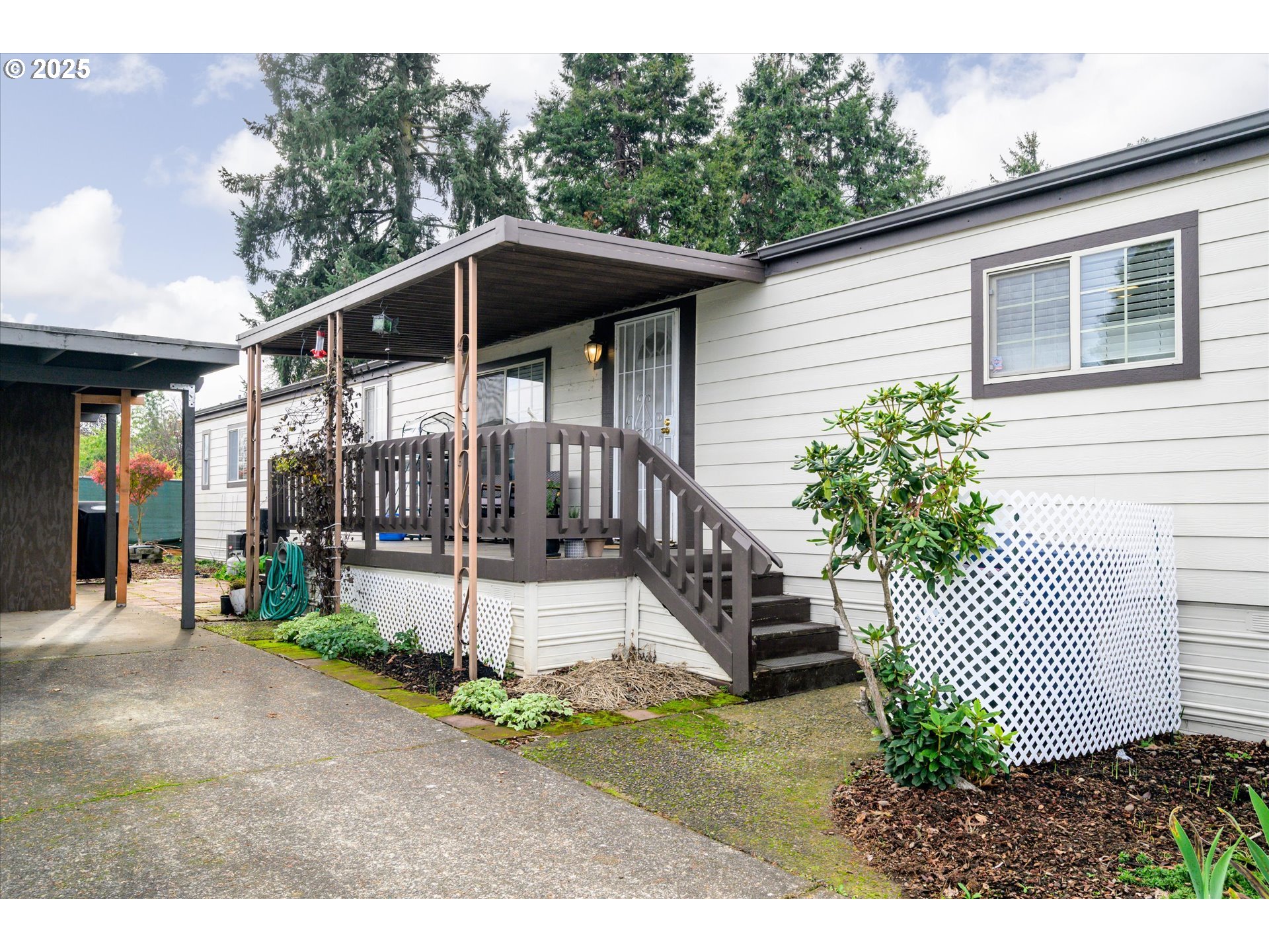 2150 Laura Street, Unit 111 Springfield, OR 97477 - Photo 5 of 30 a view of house with a yard and porch