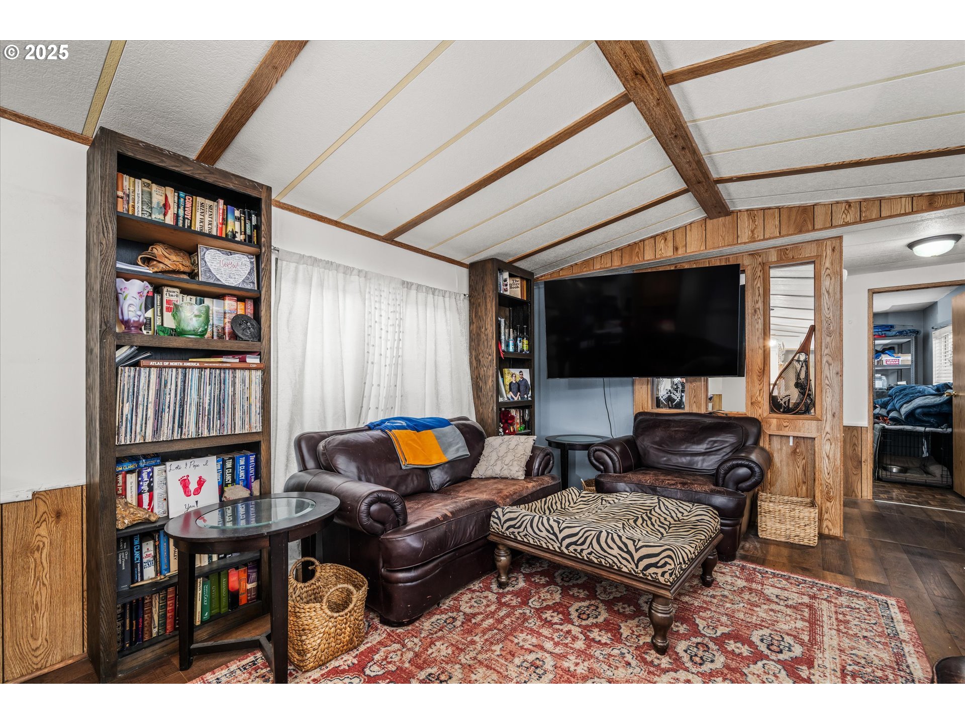 2150 Laura Street, Unit 111 Springfield, OR 97477 - Photo 9 of 30 a living room with furniture and a flat screen tv