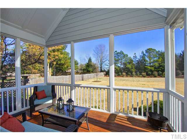 8717 Oregon Inlet Court Raleigh, NC 27603 - Photo 4 of 25 RELAX! Plenty of room for ball games in this yard! Enjoy the shade while watching! Screened Porch