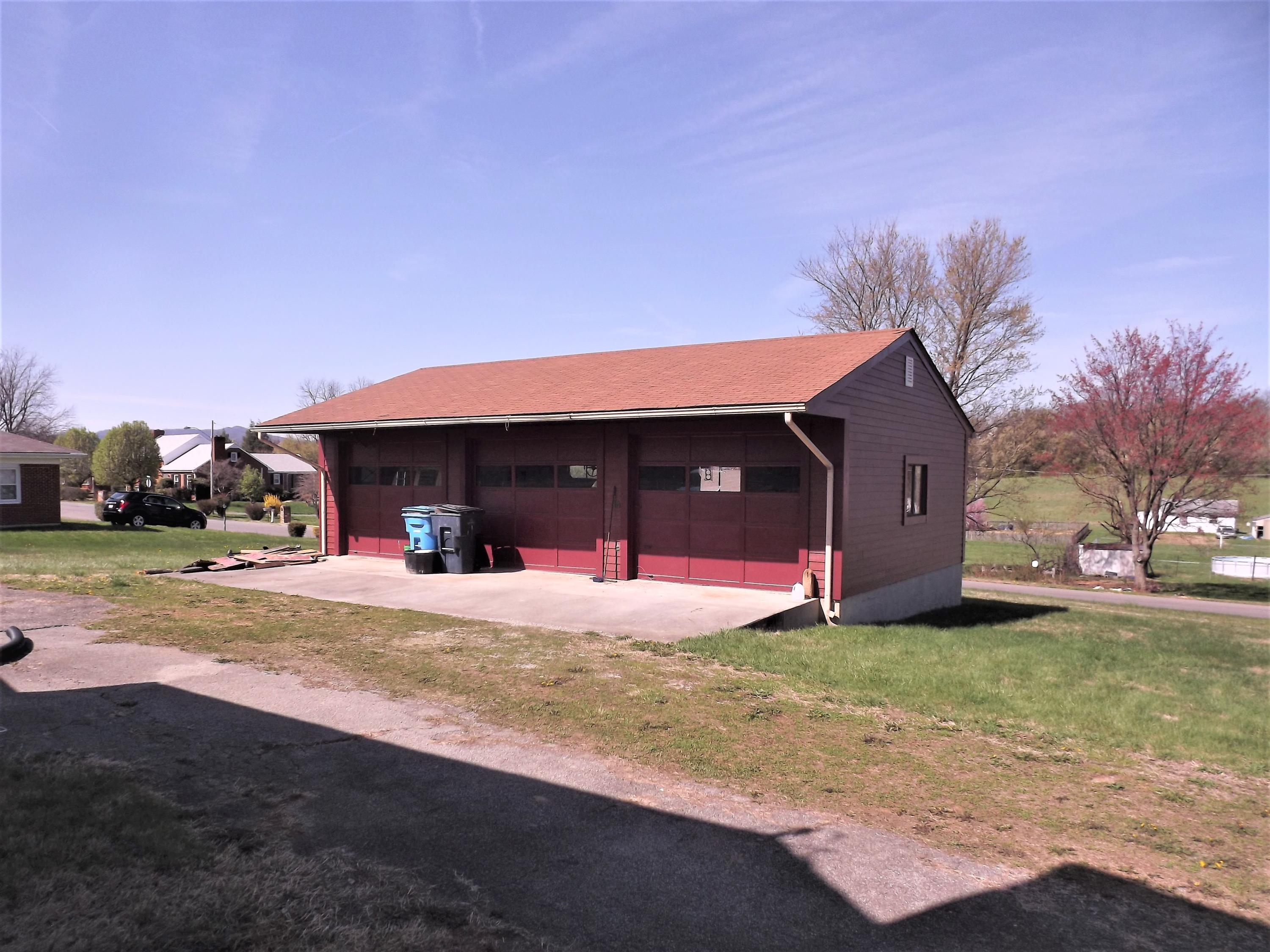 4320 Cove Road Roanoke, VA 24017 - Photo 2 of 10 a view of a house with a yard and garage