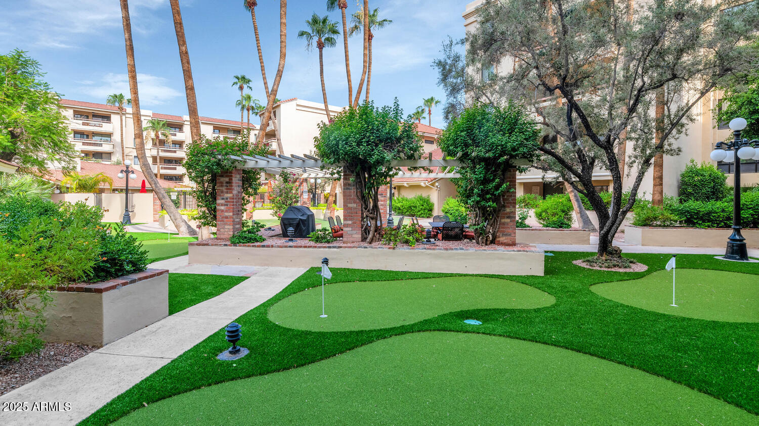 4200 North Miller Road, Unit 328 Scottsdale, AZ 85251 - Photo 17 of 22 a view of garden with patio