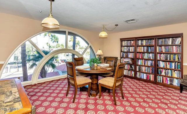 a living room with furniture and white walls
