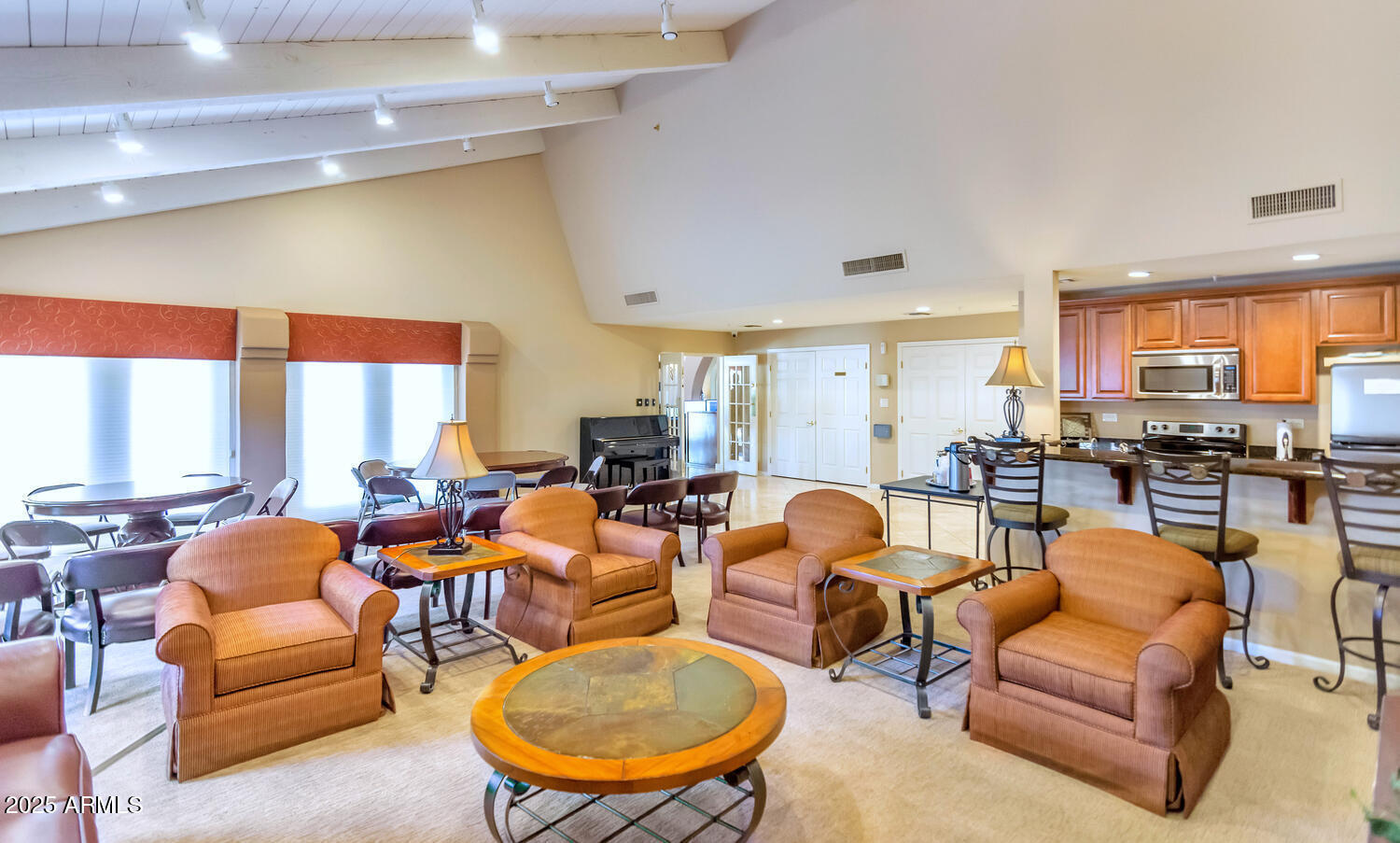 4200 North Miller Road, Unit 328 Scottsdale, AZ 85251 - Photo 22 of 22 a living room with furniture a fireplace and a large window