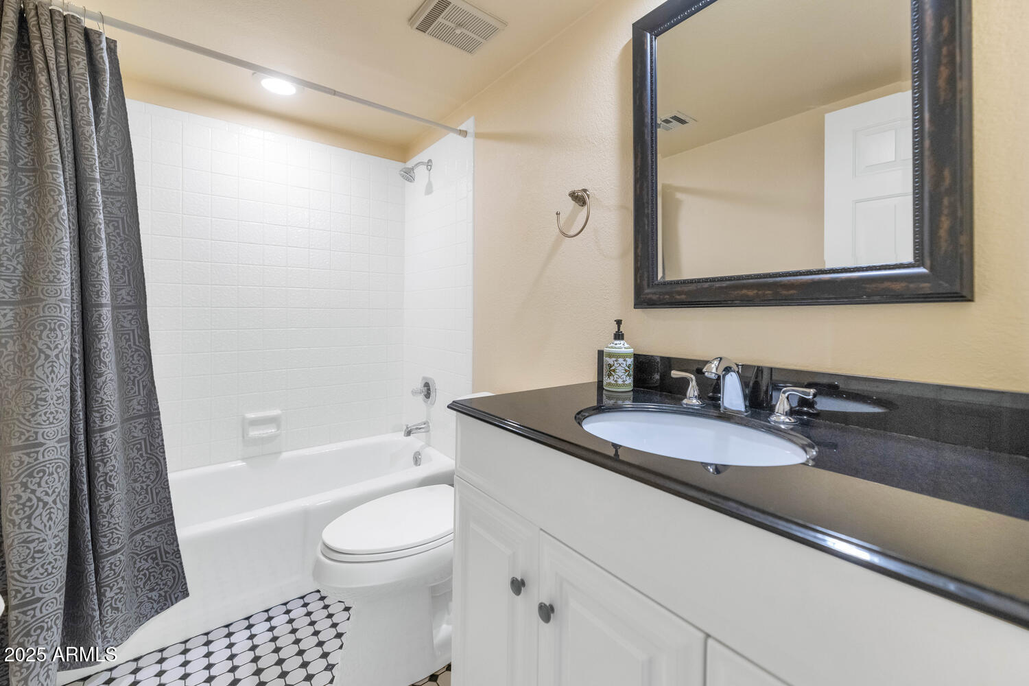 4200 North Miller Road, Unit 328 Scottsdale, AZ 85251 - Photo 5 of 22 a bathroom with a granite countertop sink toilet a mirror and shower