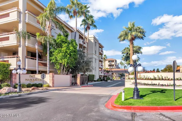 a view of a street with houses a street and trees