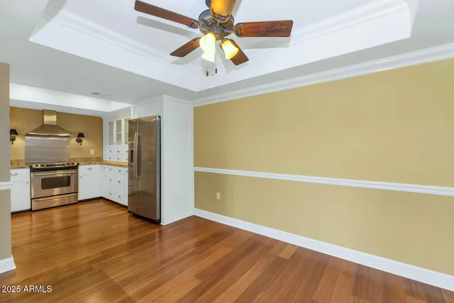 a view of a kitchen with a stove cabinets