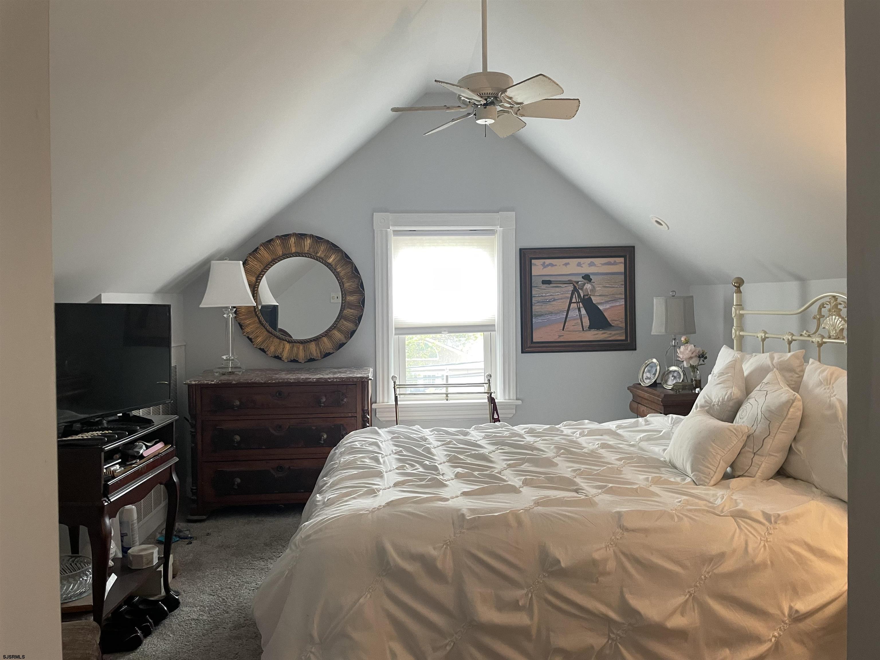 636 Shore Road Somers Point, NJ 08244 - Photo 13 of 25 a bedroom with a bed a dresser and chair