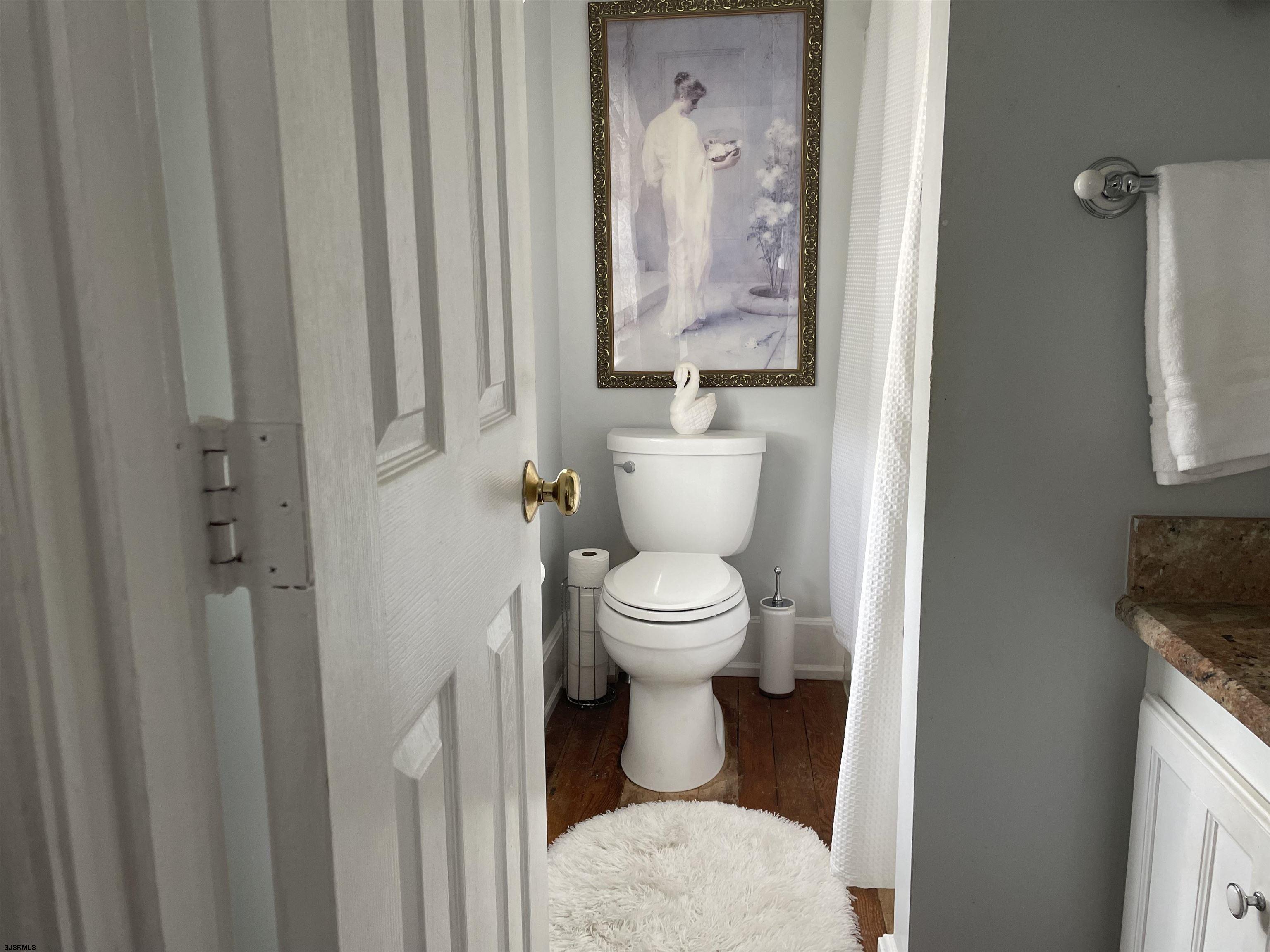 636 Shore Road Somers Point, NJ 08244 - Photo 20 of 25 a white toilet sitting next to a bathroom sink