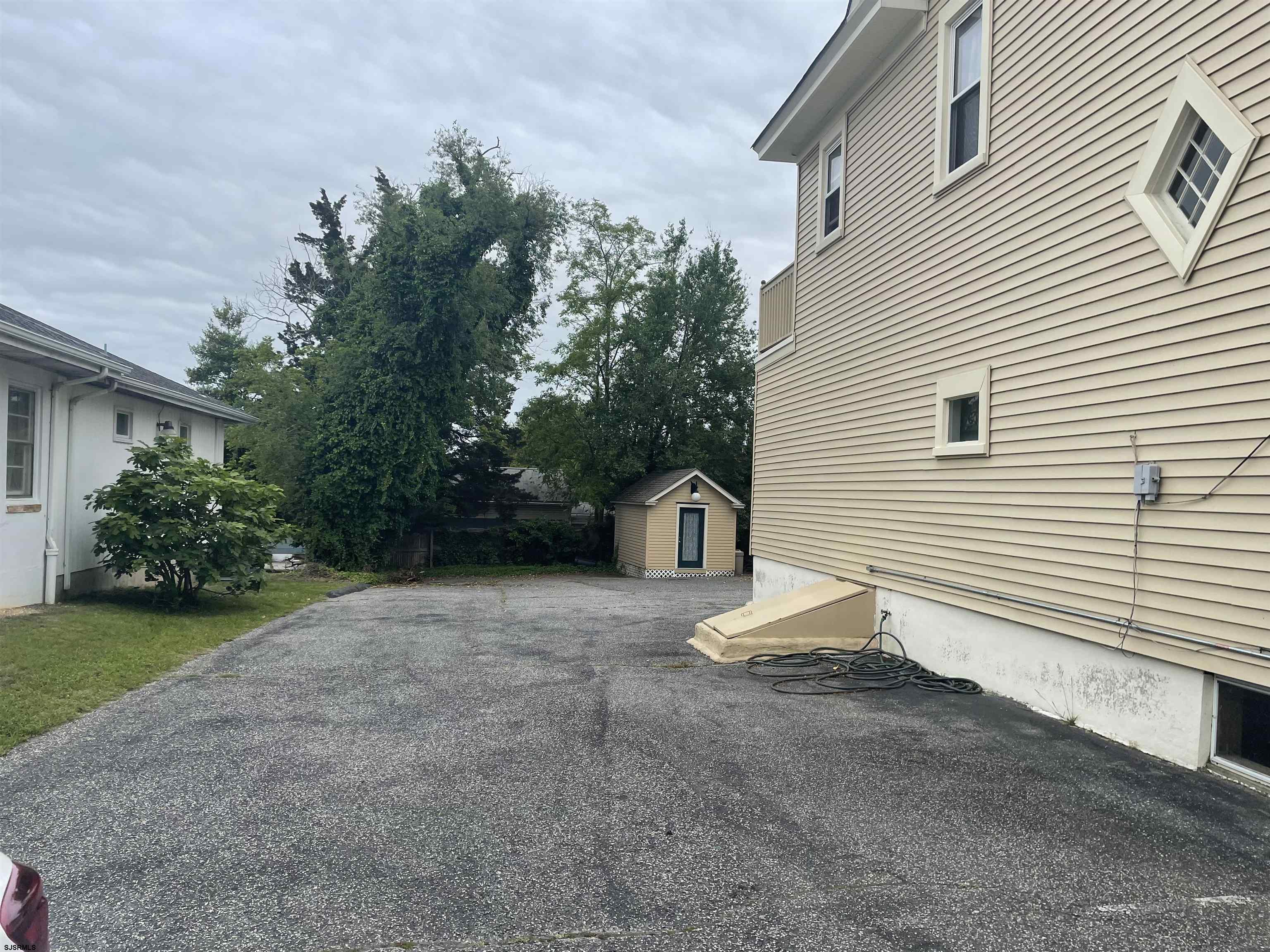 636 Shore Road Somers Point, NJ 08244 - Photo 23 of 25 a view of a house with a yard and garage
