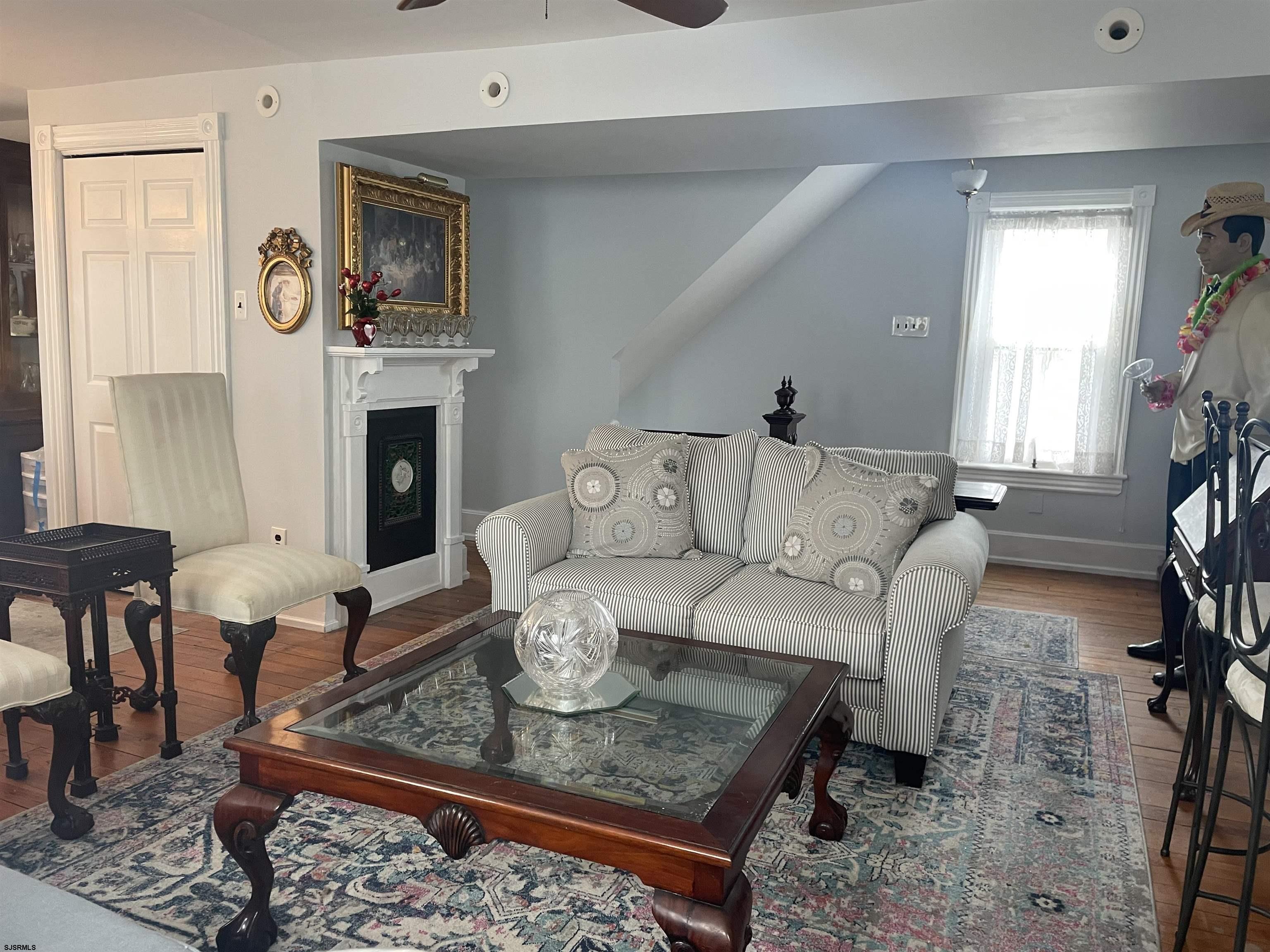 636 Shore Road Somers Point, NJ 08244 - Photo 3 of 25 a living room with furniture and a fireplace