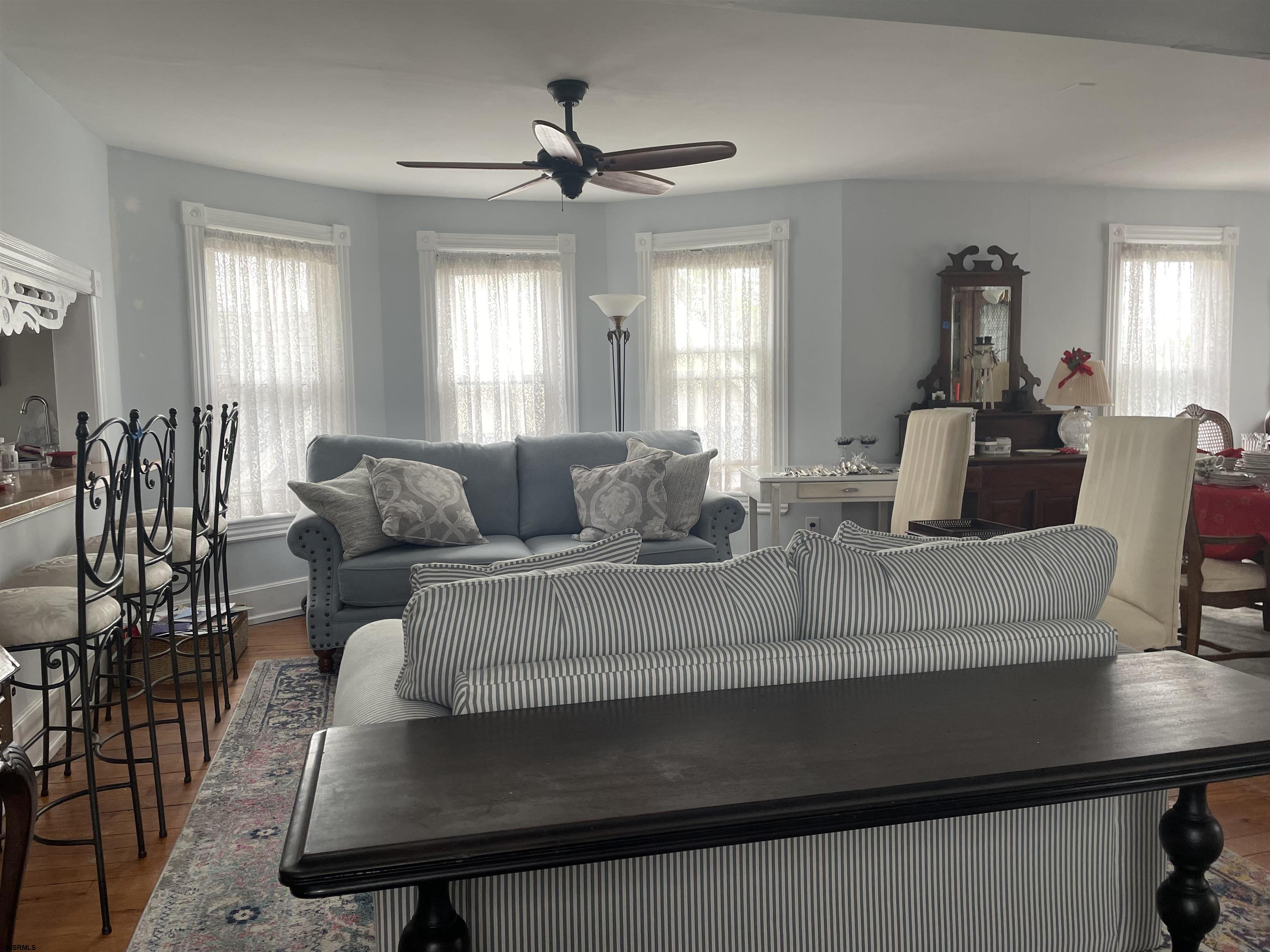 636 Shore Road Somers Point, NJ 08244 - Photo 4 of 25 a living room with furniture a two desk and a window