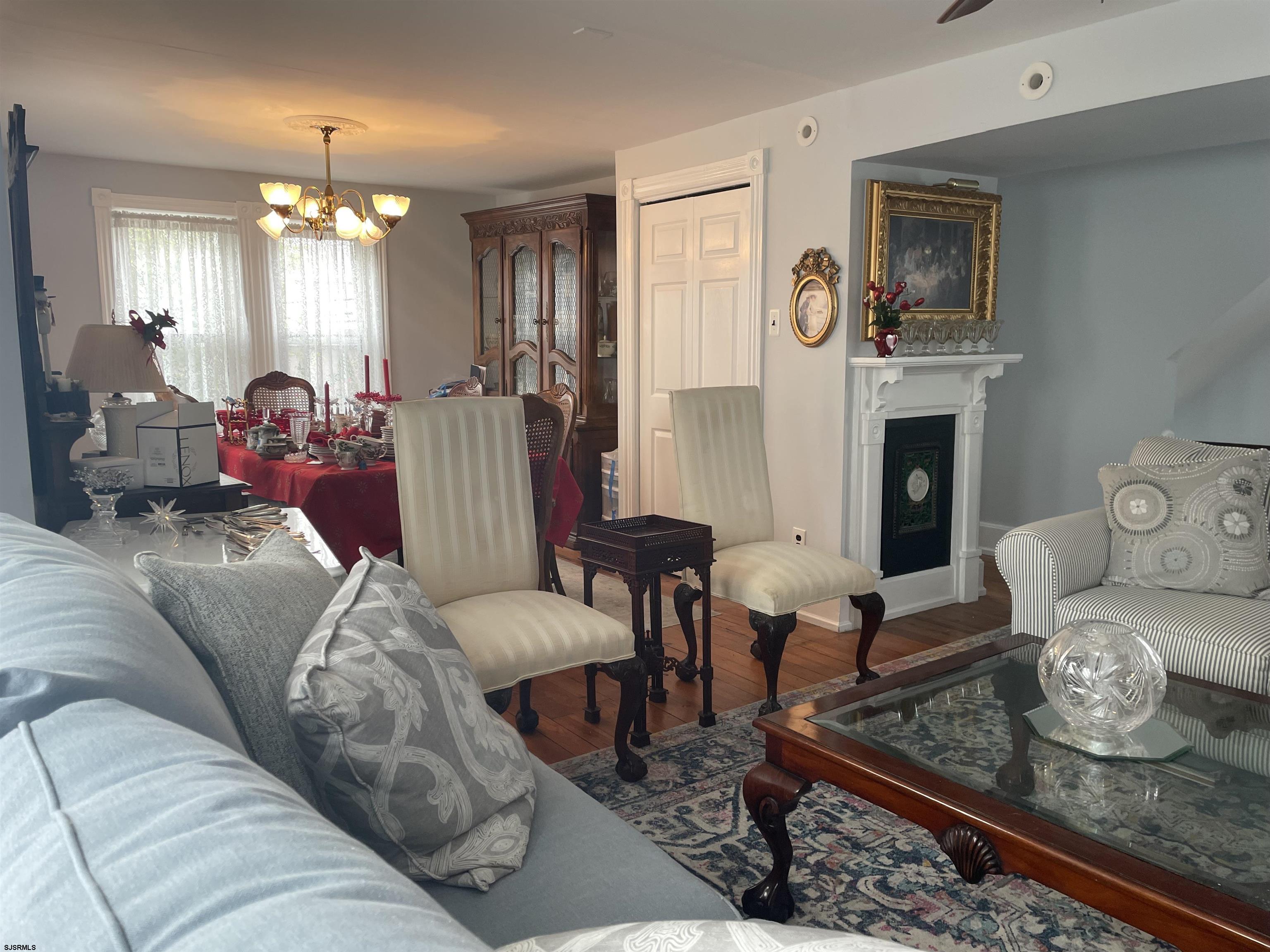 636 Shore Road Somers Point, NJ 08244 - Photo 6 of 25 a living room with furniture and a chandelier