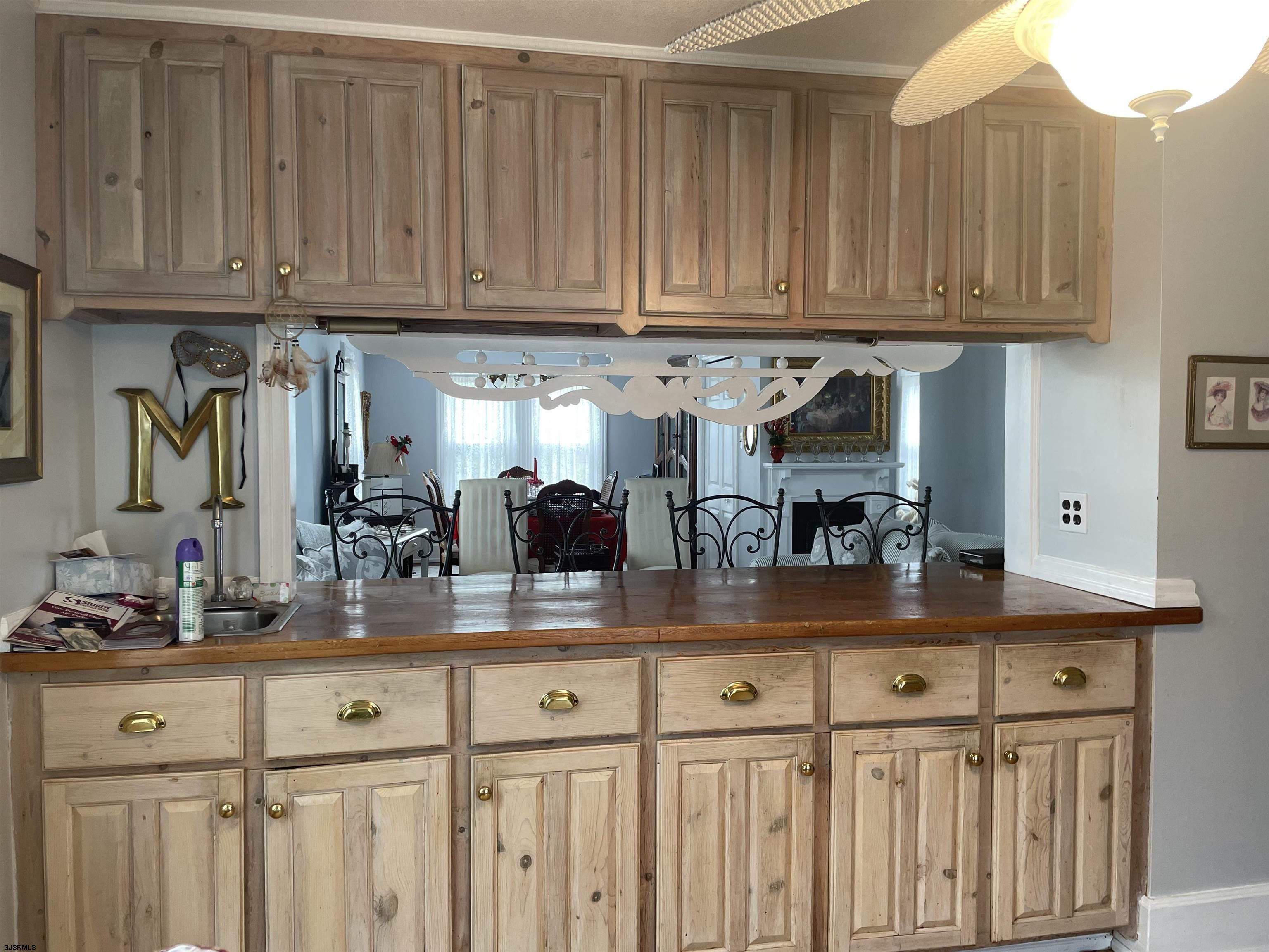 636 Shore Road Somers Point, NJ 08244 - Photo 8 of 25 a kitchen with stainless steel appliances granite countertop a sink and cabinets