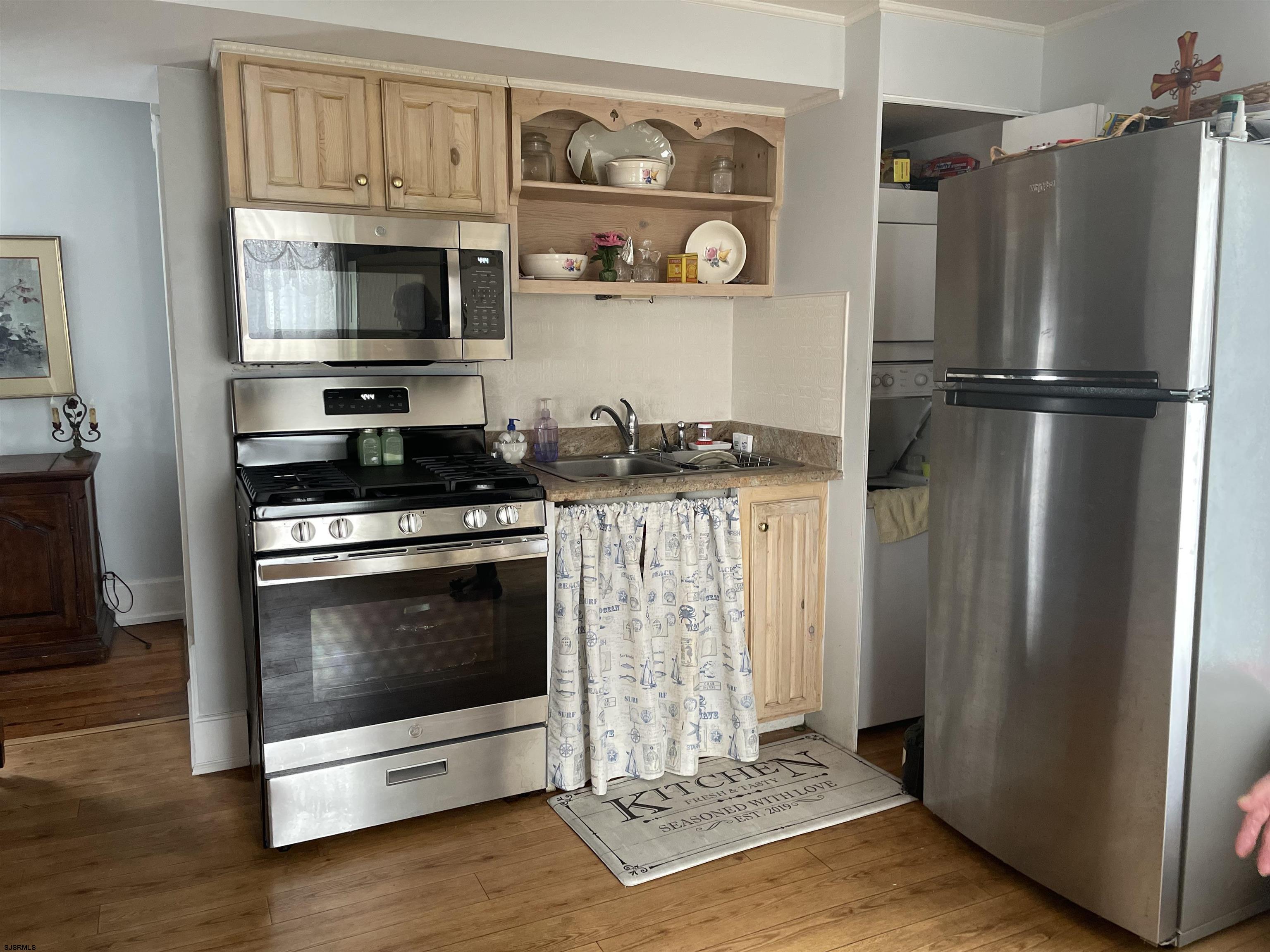 636 Shore Road Somers Point, NJ 08244 - Photo 9 of 25 a kitchen with stainless steel appliances granite countertop a refrigerator stove and microwave