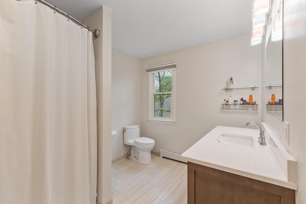 94 Turner Road Townsend, MA 01469 - Photo 22 of 42 a bathroom with a sink a toilet and a mirror