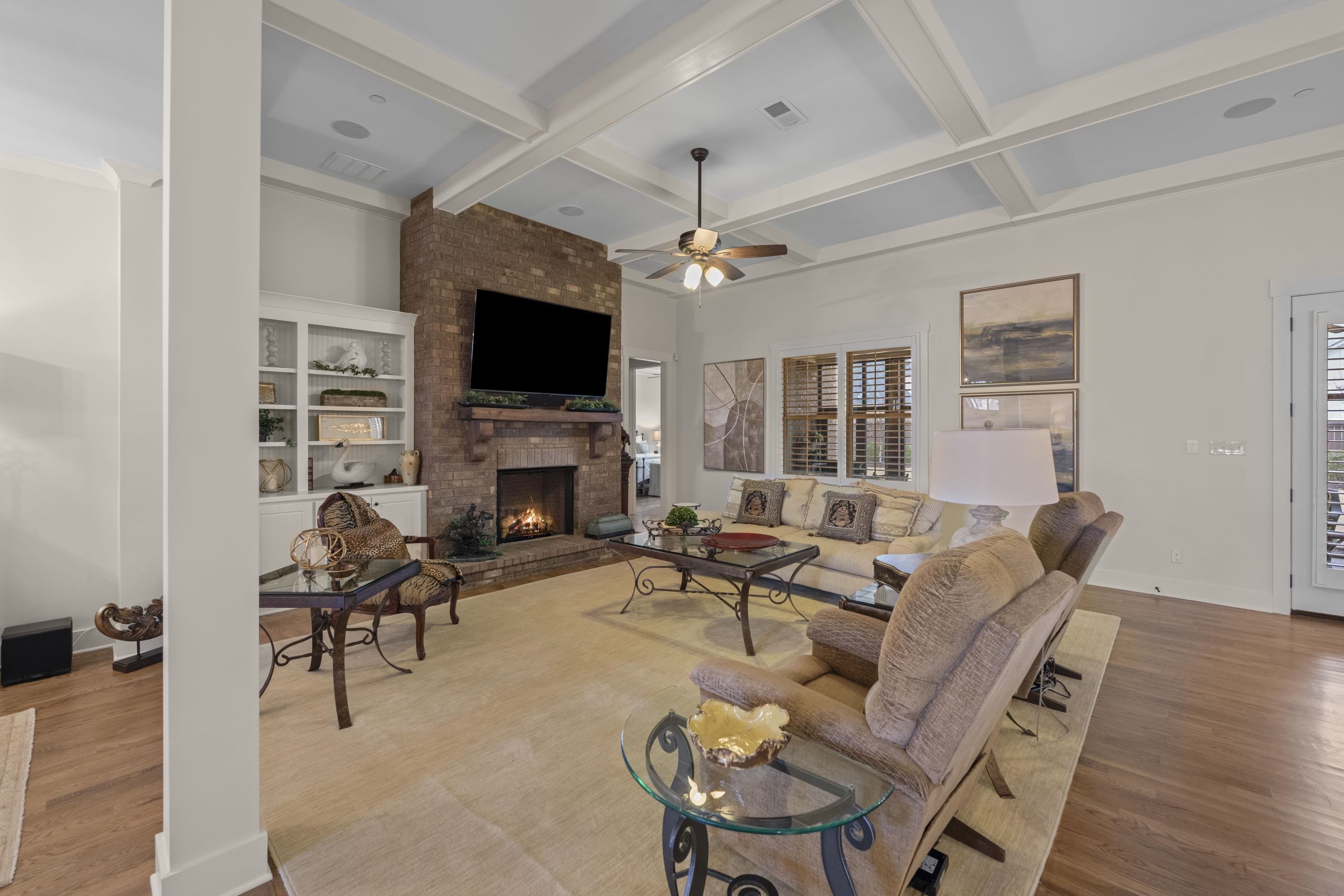 195 Hunters Rest Lane Piperton, TN 38017 - Photo 12 of 36 a living room with furniture a flat screen tv and a fireplace