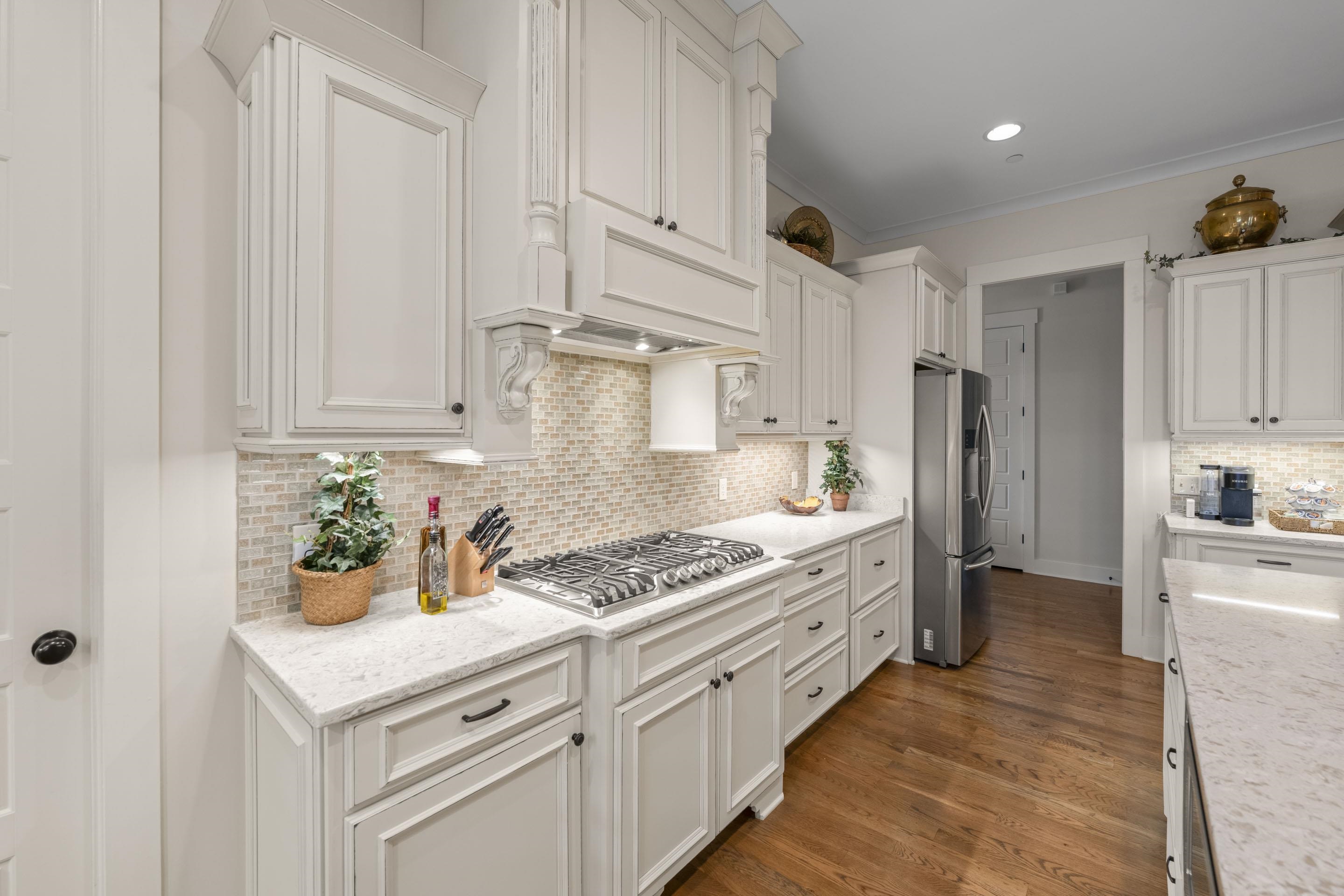 195 Hunters Rest Lane Piperton, TN 38017 - Photo 16 of 36 a kitchen with stainless steel appliances white cabinets and a refrigerator