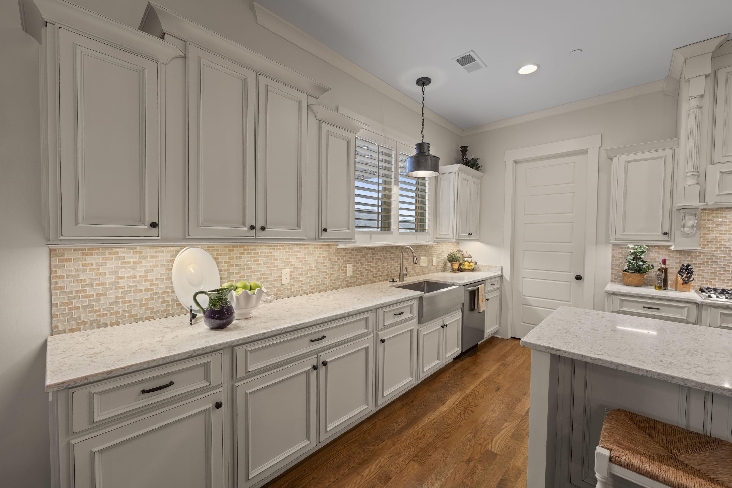 195 Hunters Rest Lane Piperton, TN 38017 - Photo 18 of 36 a kitchen with a sink dishwasher stove and cabinets