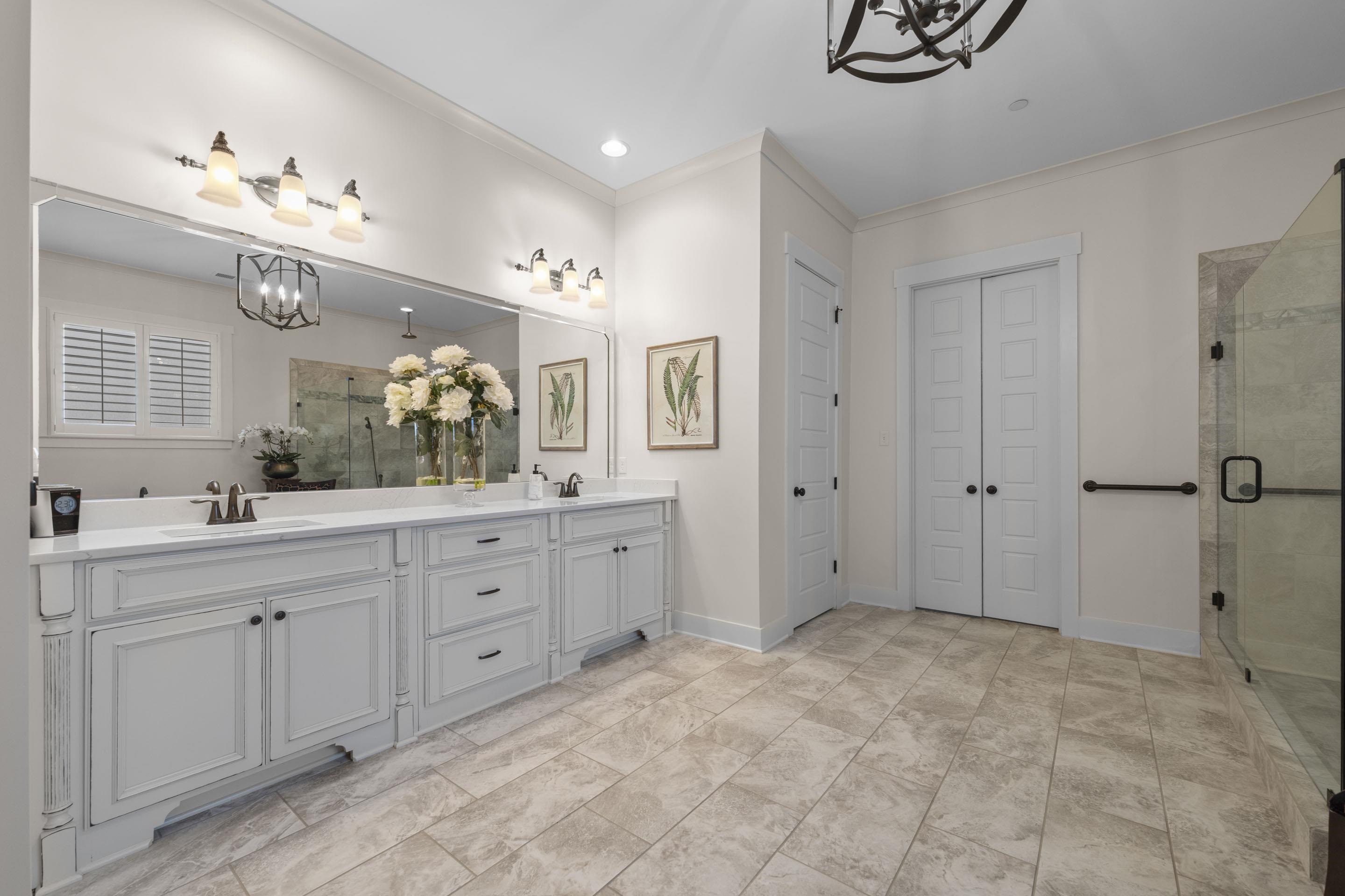 195 Hunters Rest Lane Piperton, TN 38017 - Photo 20 of 36 a spacious bathroom with a granite countertop sink mirror and a