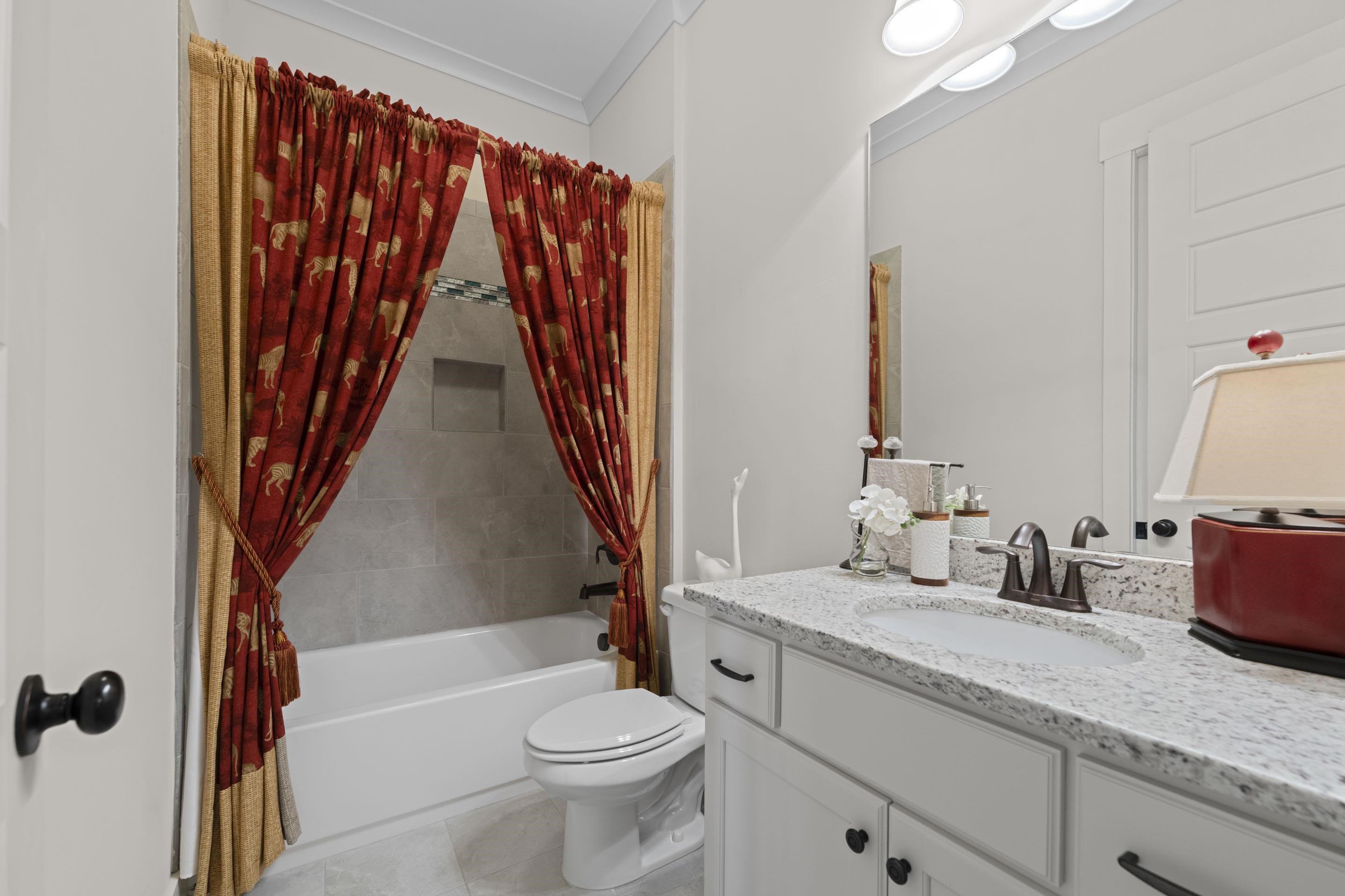 195 Hunters Rest Lane Piperton, TN 38017 - Photo 23 of 36 a bathroom with a sink a toilet and a tub