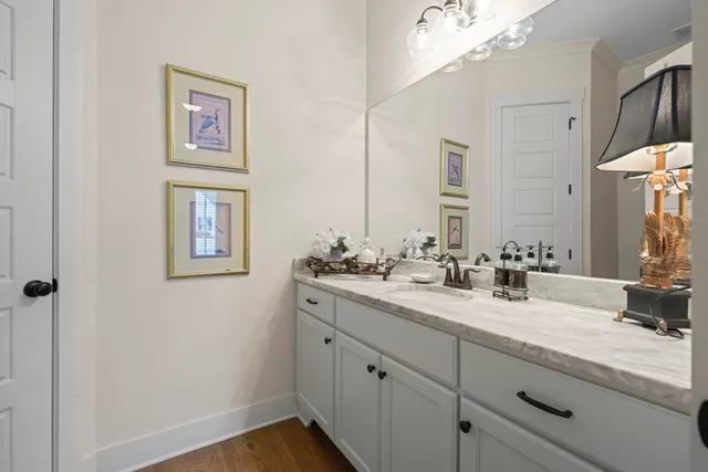 a bathroom with a double vanity sink and a mirror