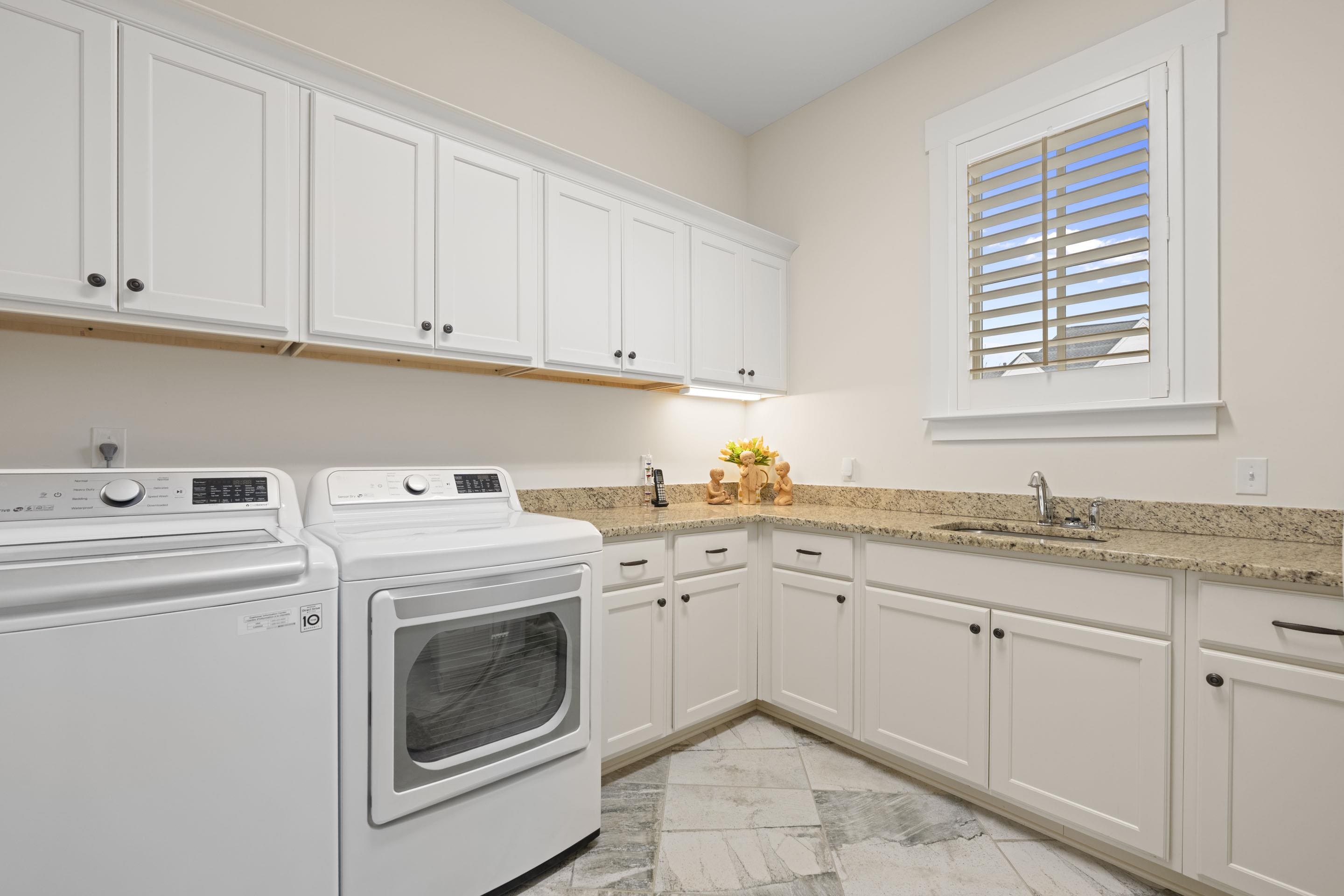 195 Hunters Rest Lane Piperton, TN 38017 - Photo 25 of 36 a utility room with sink dryer and washer