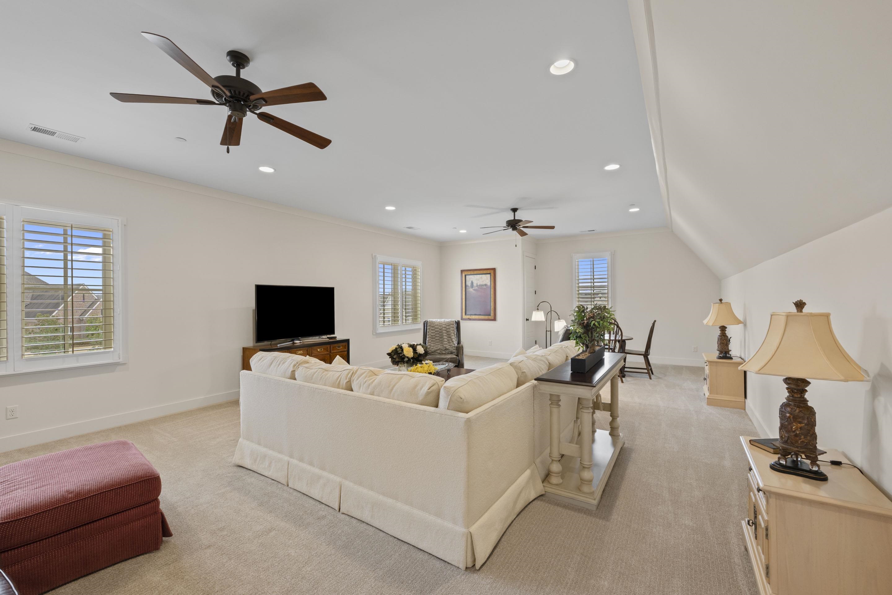 195 Hunters Rest Lane Piperton, TN 38017 - Photo 28 of 36 a living room with furniture and a flat screen tv