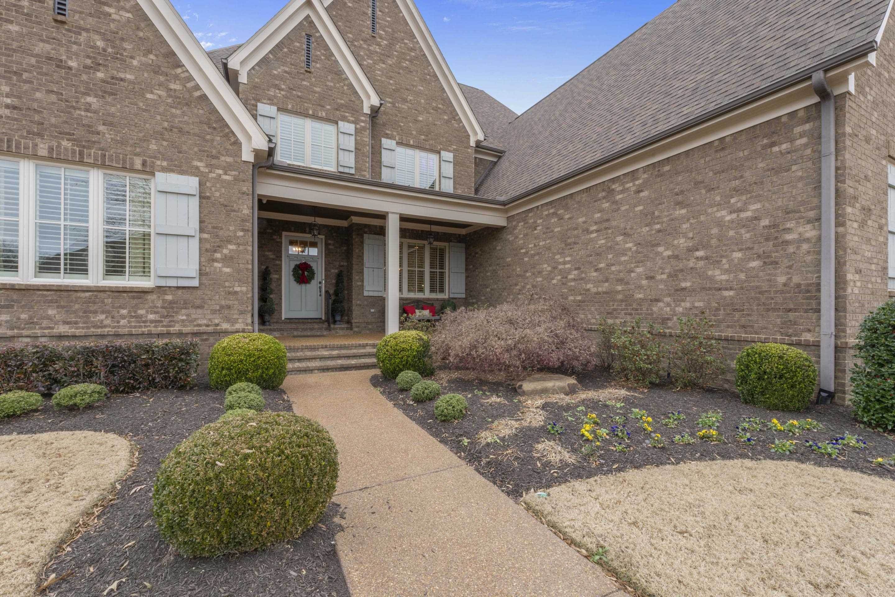 195 Hunters Rest Lane Piperton, TN 38017 - Photo 3 of 36 a front view of a house with garden