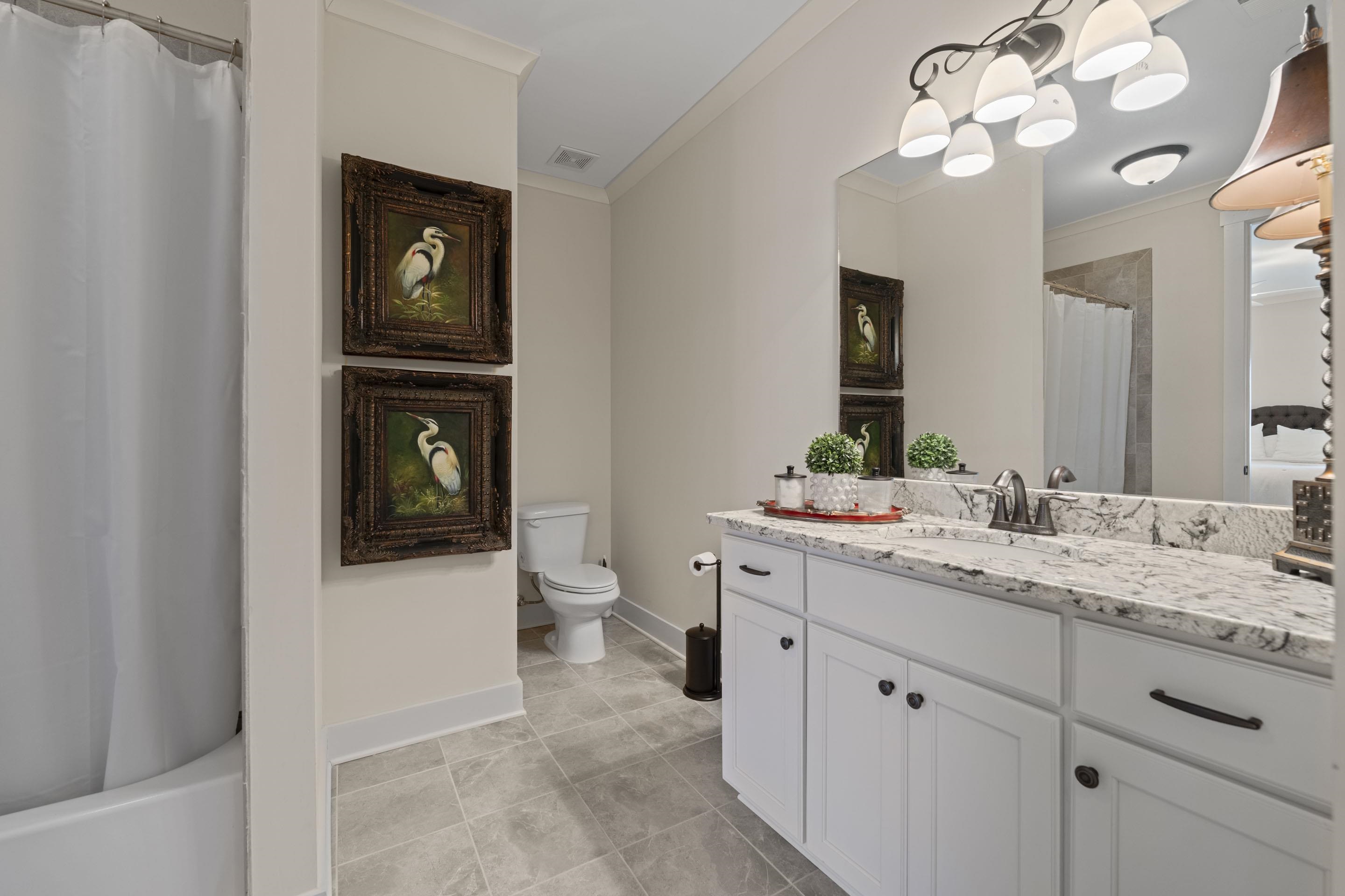 195 Hunters Rest Lane Piperton, TN 38017 - Photo 33 of 36 a bathroom with a toilet sink and mirror
