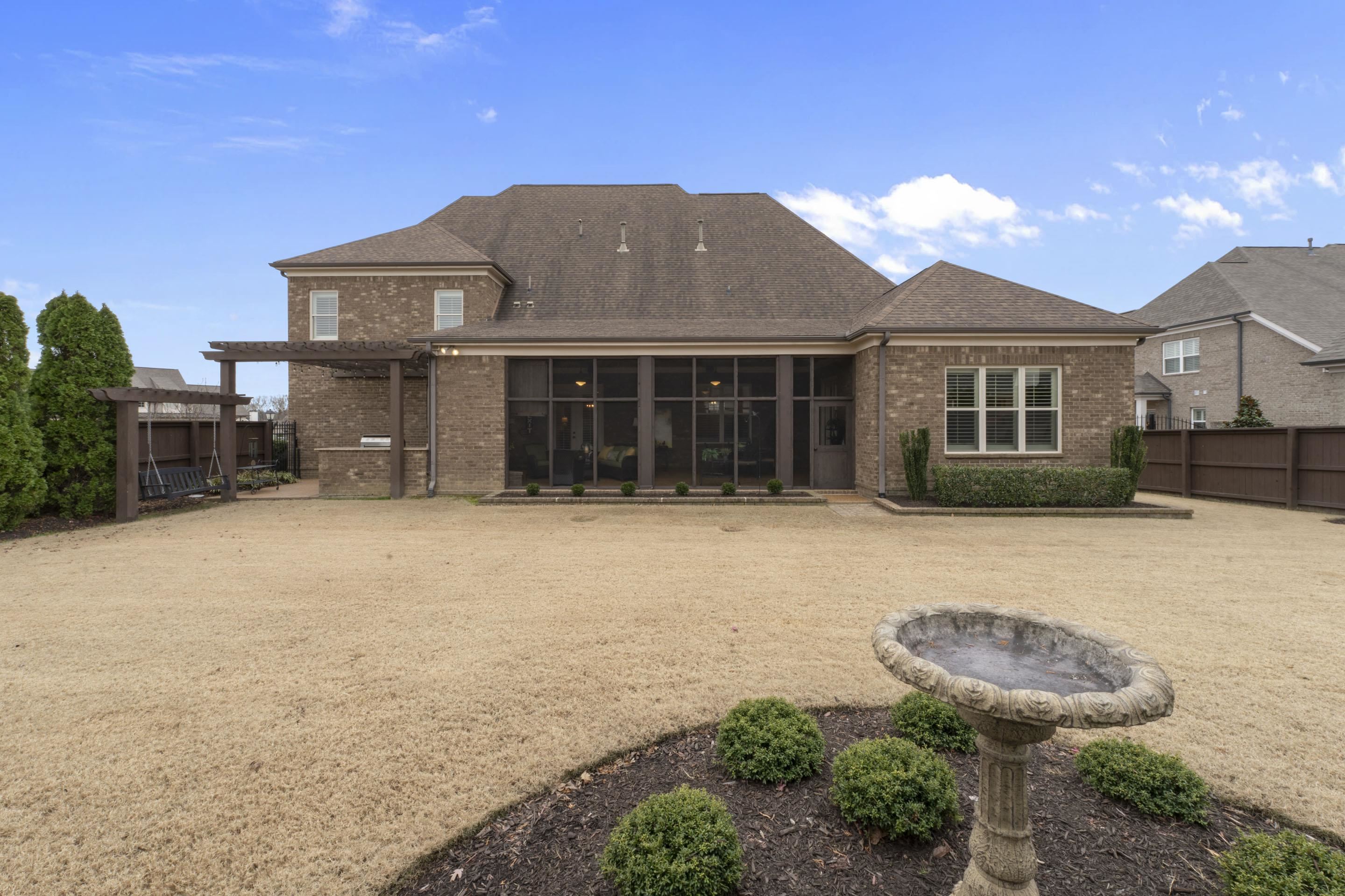 195 Hunters Rest Lane Piperton, TN 38017 - Photo 4 of 36 a front view of a house with a yard and garage