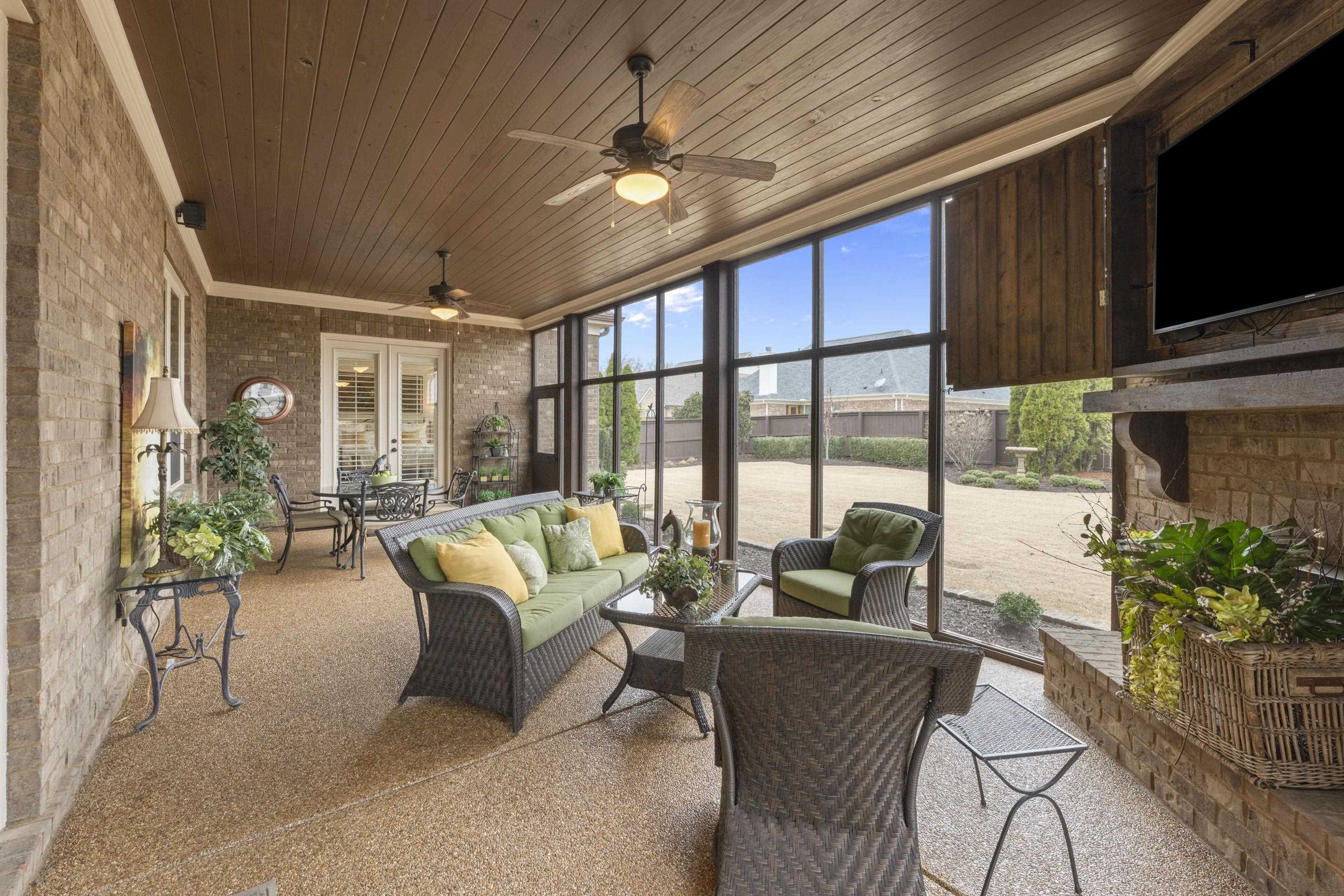 195 Hunters Rest Lane Piperton, TN 38017 - Photo 7 of 36 a living room with patio furniture and a flat screen tv