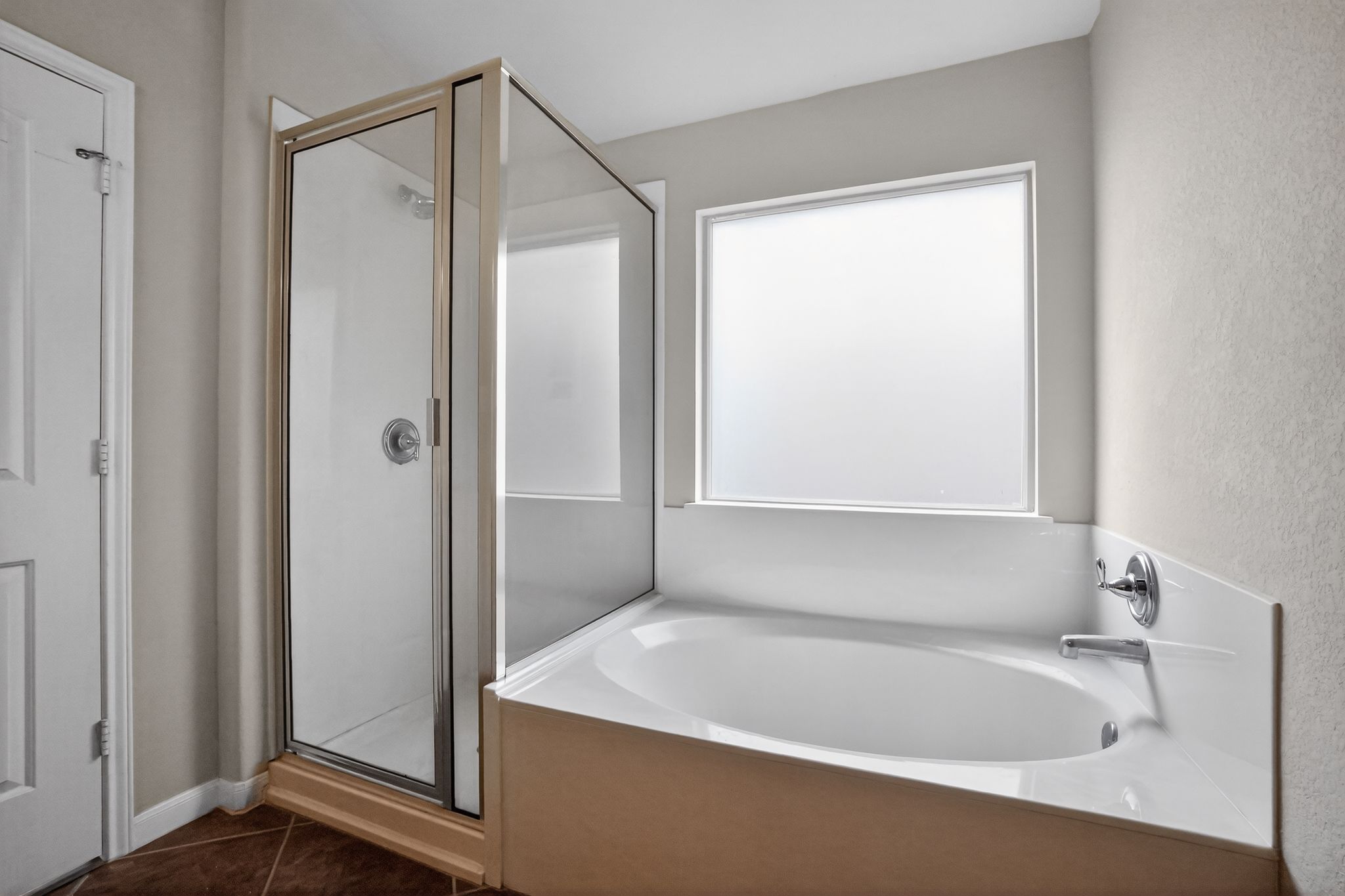 1313 April Meadows Loop Georgetown, TX 78626 - Photo 11 of 21 Bathroom featuring a stall shower, a bath, and dark tile patterned flooring